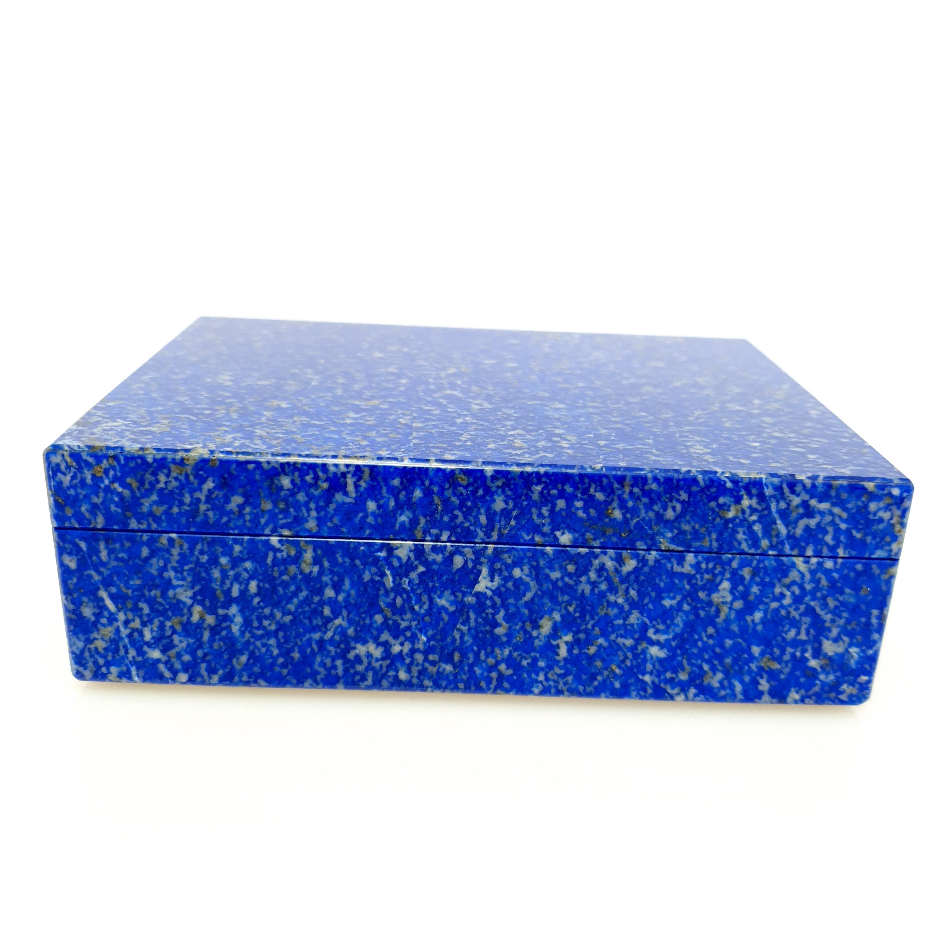 A handmade Natural White Blue Lapis Decorative Jewelry Box.
The pattern looks like an artful painting of nature.
The Inlay is made out of natural black Marble.
It's a great piece for decoration on a desk, vanity, or even as a special gift.