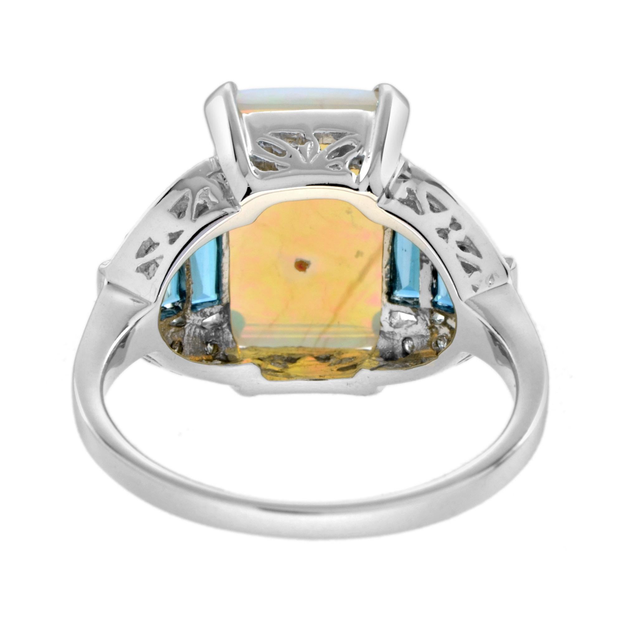 Anillo de oro blanco de 14 quilates estilo art déco con ópalo azul blanco y diamante topacio azul de Londres Corte esmeralda en venta