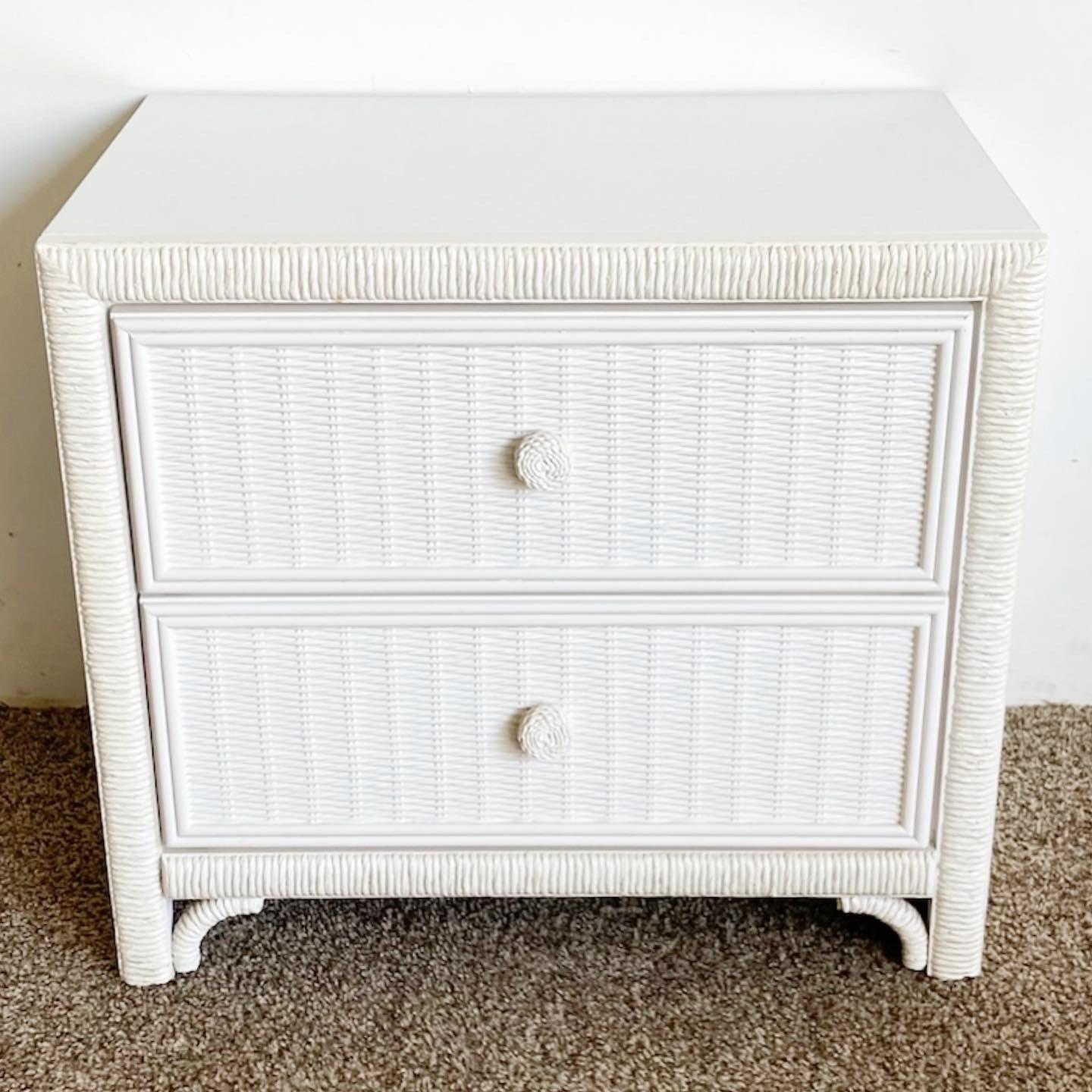 Wonderful vintage boho chic faux rattan and wicker nightstand/side table. Features a white finish.