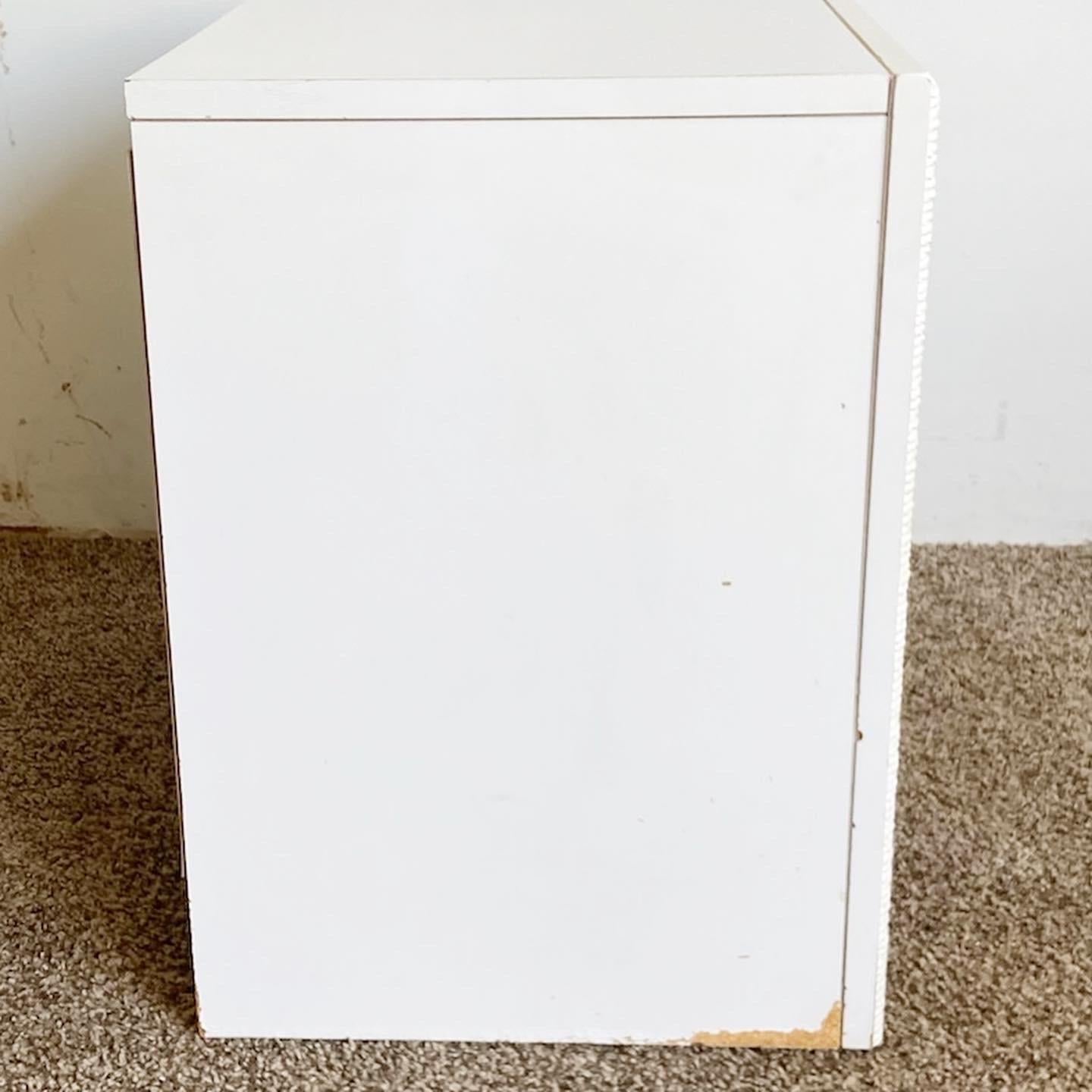 white wicker bedside table