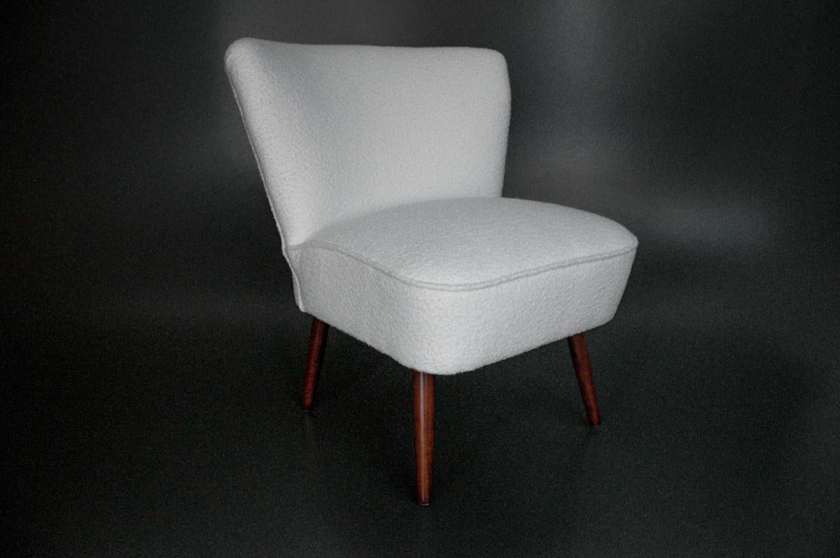 Cub chair from mid-20th century.
After professional restoration, white bouclé cozy soft material in white color.
Wooden legs.
Excellent condition.