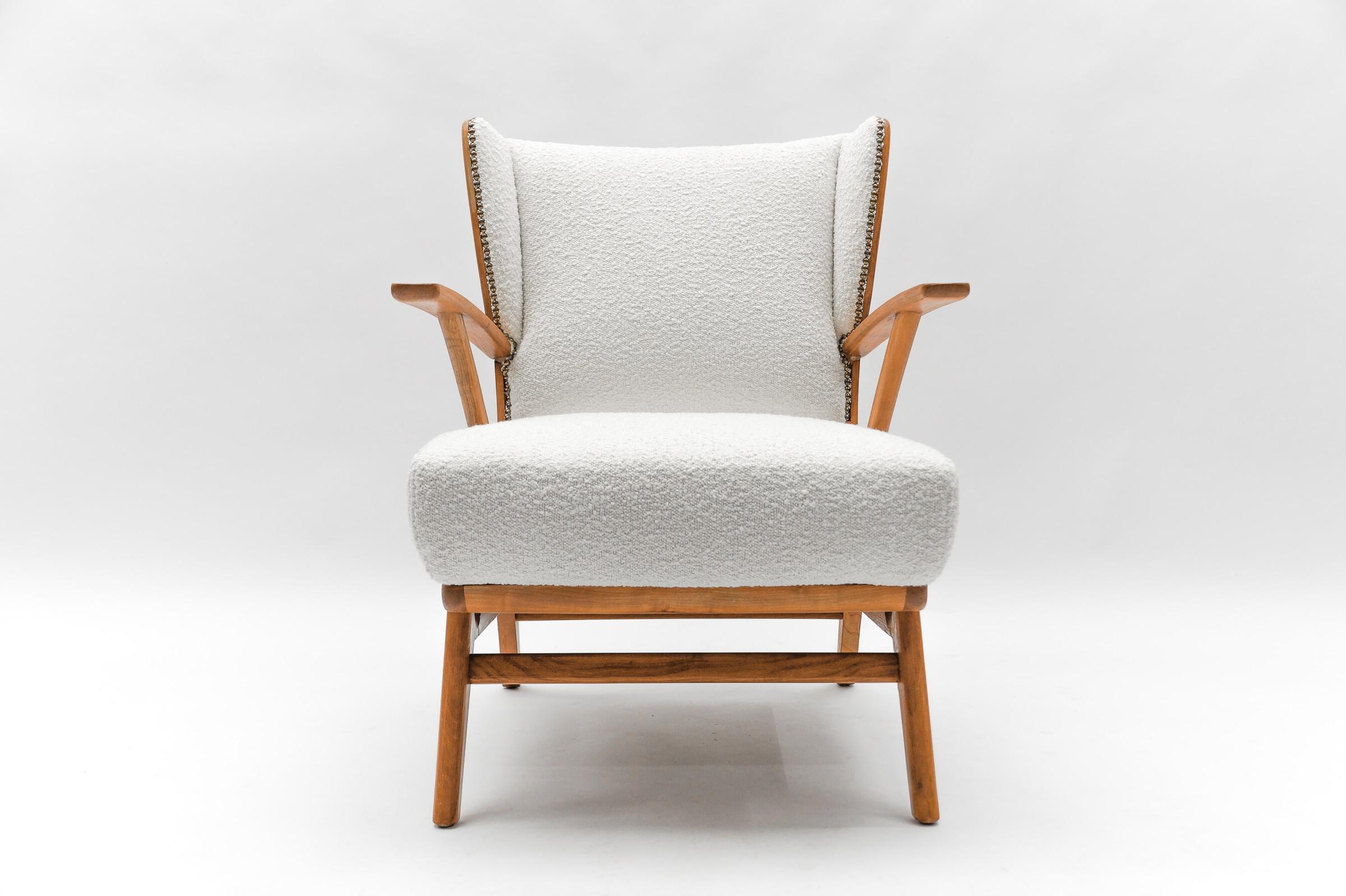 Awesome armchairs.

New upholstery in white Boucle.

We have a second identical chair here on the platform.
