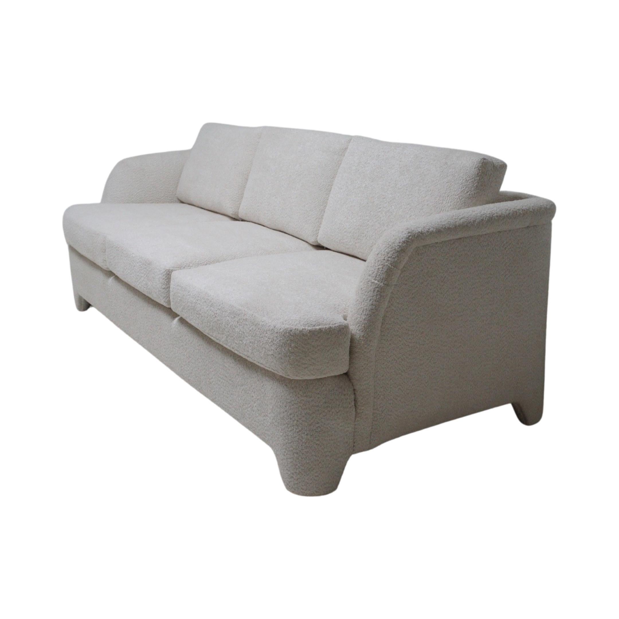 This sofa doesn't just invite you to sit; it practically throws confetti and shouts, 