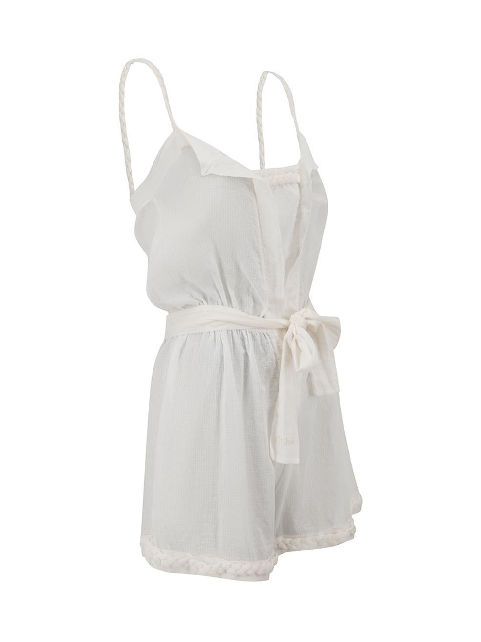 CONDITION is Good. Minor wear to playsuit is evident. Light wear to fabric with some loose thread ends at seams throughout on this used Chloé designer resale item.



Details


White

Cotton

Sleeveless playsuit

Sheer

Braided accent

Elasticated