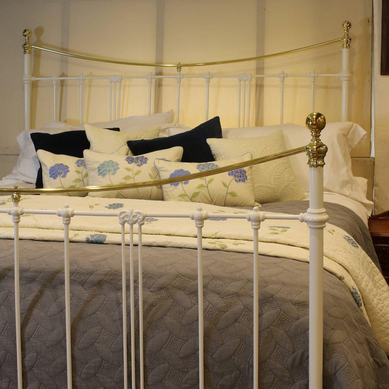 A brass and iron bed with a curved top rail and art nouveau castings, finished in white.

This bed accepts a British Super king-size or Californian King (6ft, 72 inches or 180cm wide) base and mattress set.

The price is for the bed frame alone.