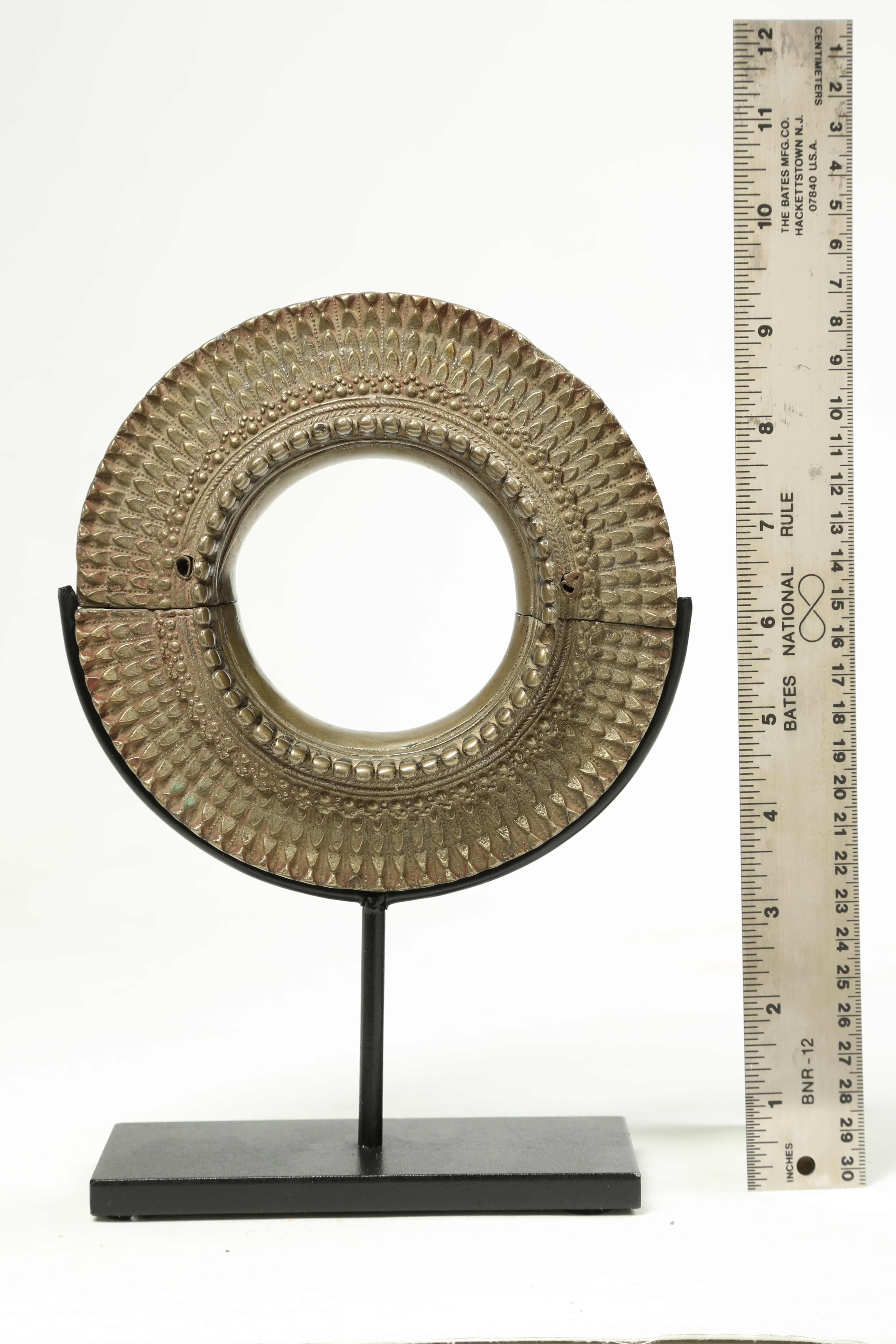 White bronze or other metal alloy East African, Asian or possibly Indian large bracelet, early 20th century. With wonderful radiating design, in two joined pieces (does not come apart). On custom metal base for elegant display. Bracelet is 6 x 6 1/4