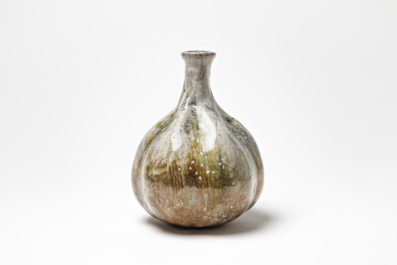 White/brown glazed ceramic vase by Gisèle Buthod Garçon. 
Raku fired. Artist monogram under the base. Circa 1980-1990. 
H : 9.4’ x 5.9’ inches.