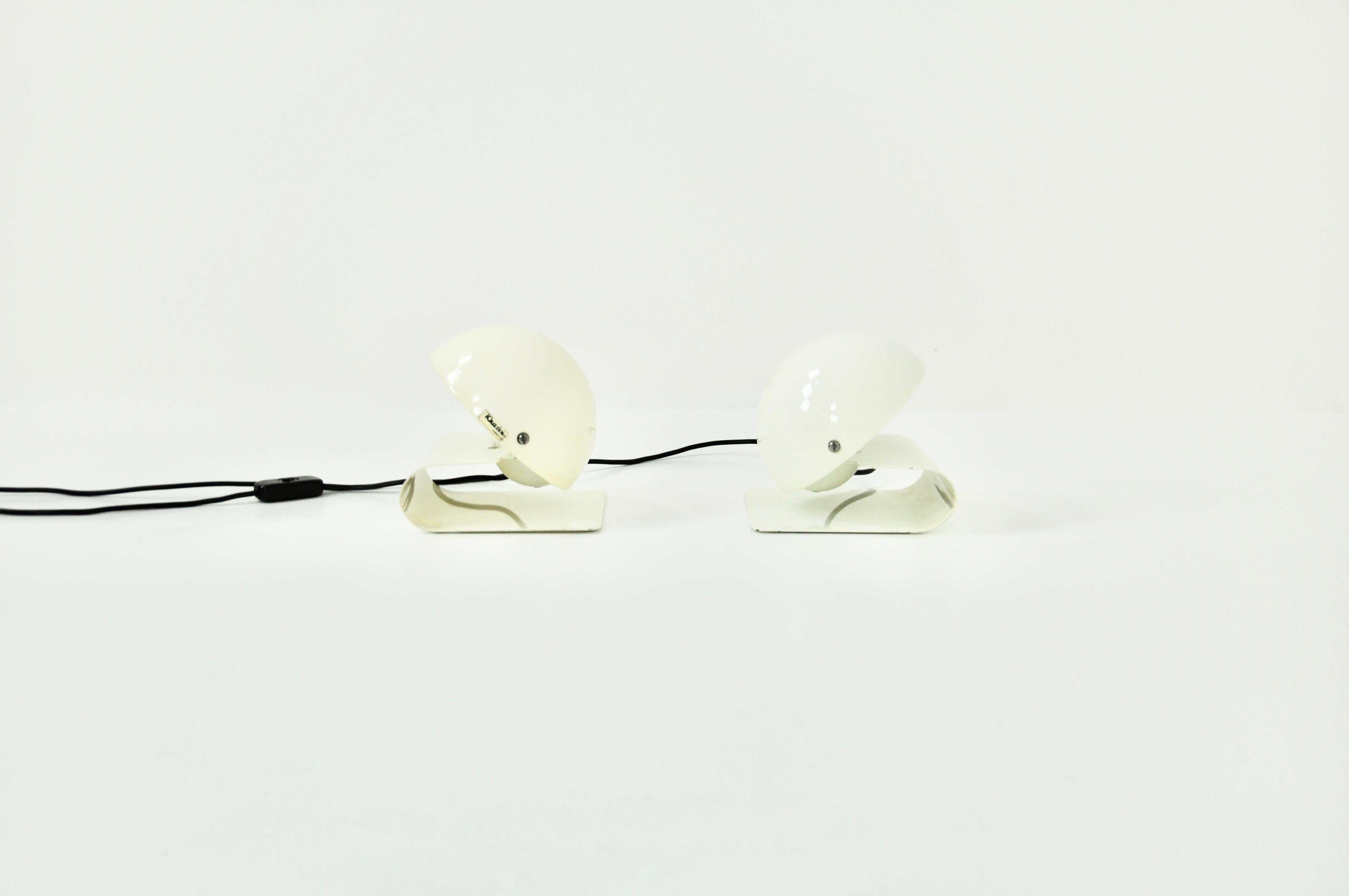 Pair of white color lamp. Stamped IGUZZINI. Wear due to time and the age of the lamp.