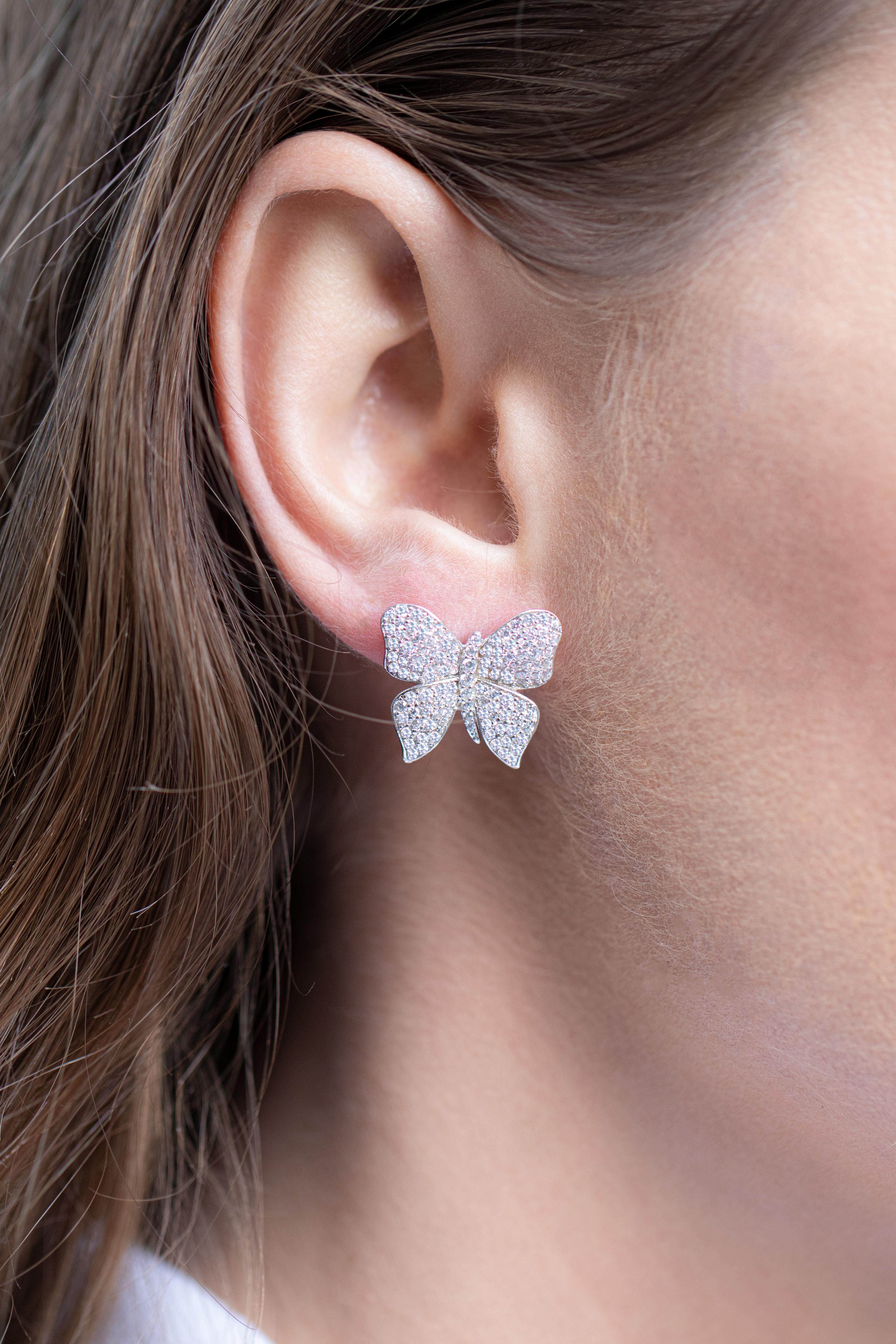 Butterfly Earrings 
Gemstone: Very Fine Cubic Zirconia
Metal: Rhodium Finish Sterling
Style: French