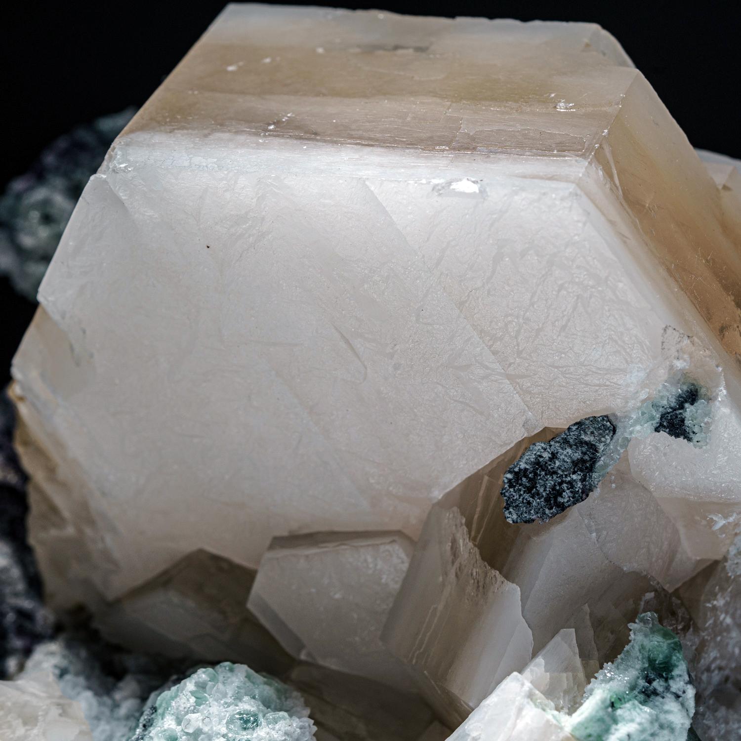 From Huanggang Mine, Kèshíkèténg Qí, Chifeng, Inner Mongolia, China

Lustrous translucent gray-white with transparent colorless calcite crystals.

Weight: 3.9 lbs, Dimensions: 7 x 4 x 5 inches.