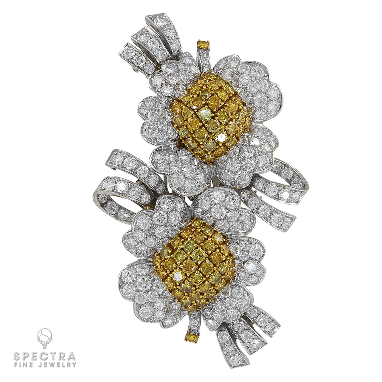 Although made in the late 20th century, circa 1990s, this Vintage Diamond Blossom Convertible Double Clip Brooch is expertly hand fabricated with the same rigorous attention paid to the details of its Jazz Age counterparts. The piece appears to be a