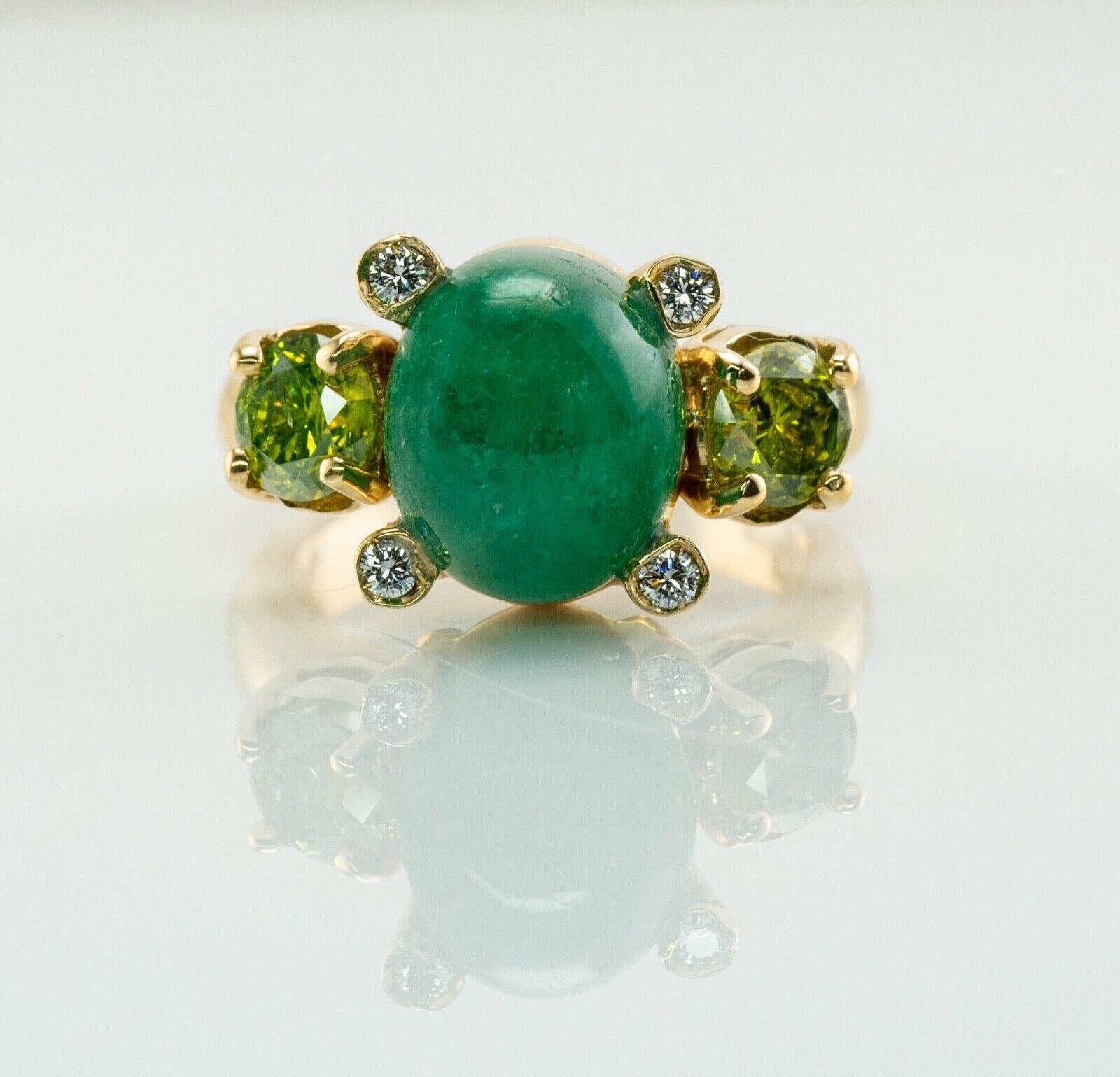 This gorgeous vintage ring is finely crafted in solid 18K Yellow Gold, made in Italy. The center Emerald cabochon is 11x9mm (3.75 carats). This gem has some minor signs of wear which cannot be seen without magnification. Two natural fancy canary