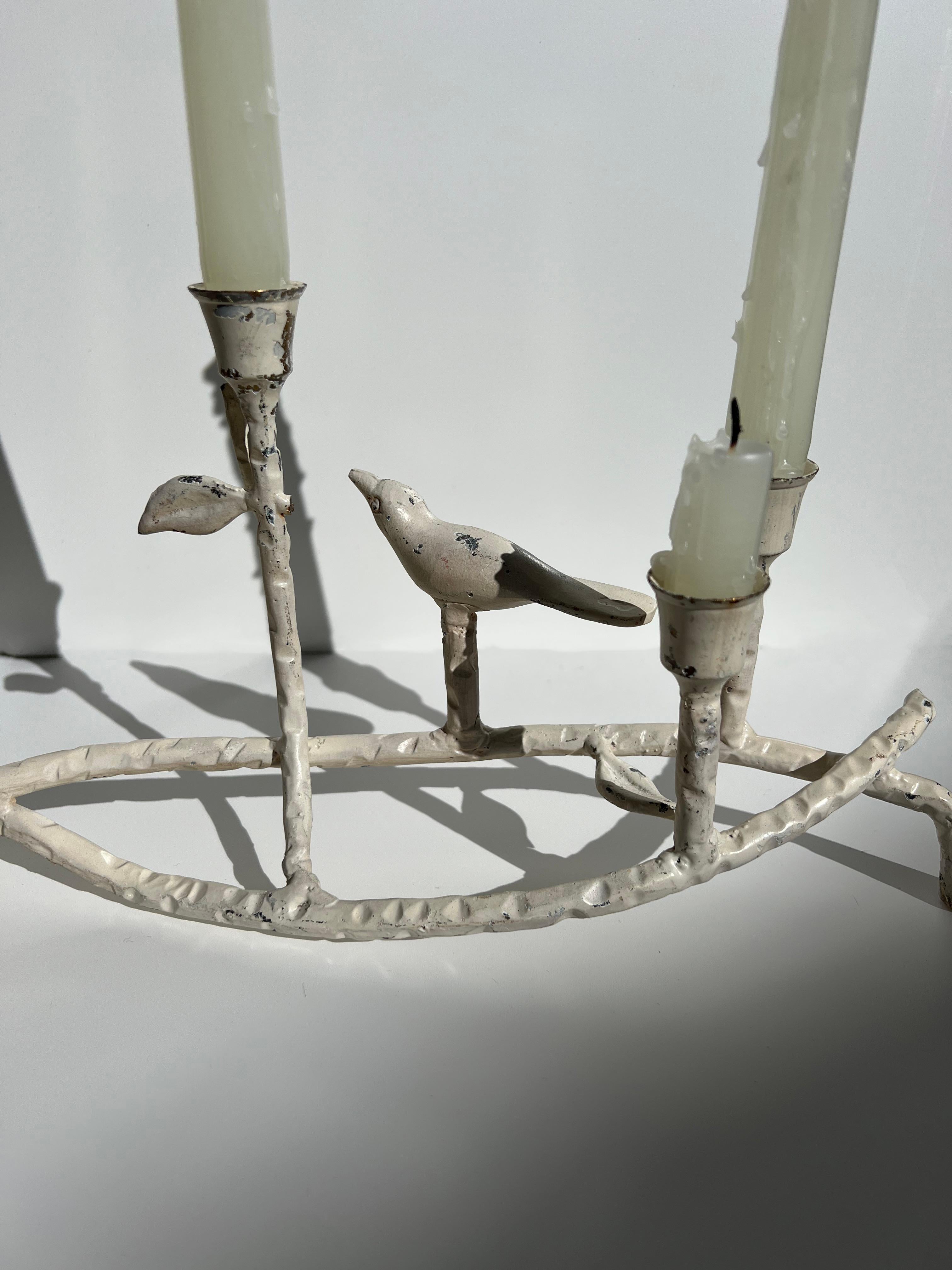 Enrich your decor with our exquisite vintage white ceramic candelabra, a showcase of intricate design and remarkable craftsmanship. This piece features a branch-like structure, adorned with delicate details such as a bird figure and leaf accents,