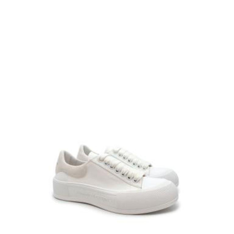 Alexander McQueen White Canvas Deck Sneakers
 

 - Chunky, low top style
 - Thick cotton laces
 - Tonal suede heel cuff
 - Thick rubber toe cap and thick sole 
 

 Materials
 Canvas
 Suede
 Rubber
 

 PLEASE NOTE, THESE ITEMS ARE PRE-OWNED AND MAY