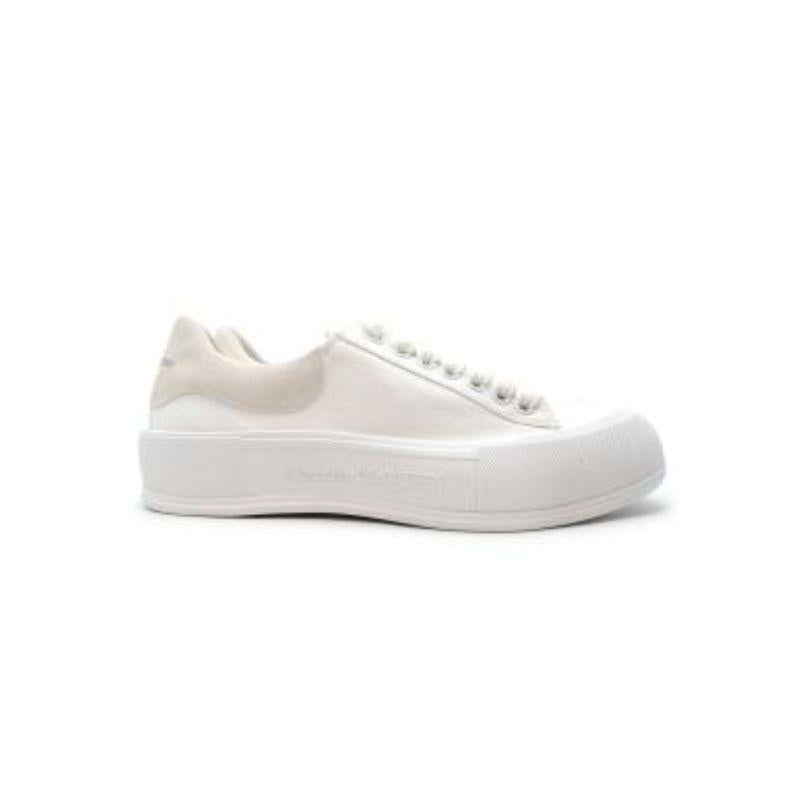 Alexander McQueen white canvas Deck sneakers
 

 - Chunky, low top style
 - Thick cotton laces
 - Tonal suede heel cuff
 - Thick rubber toe cap and thick sole
 

 Materials
 Canvas
 Suede
 Rubber
 

 PLEASE NOTE, THESE ITEMS ARE PRE-OWNED AND MAY
