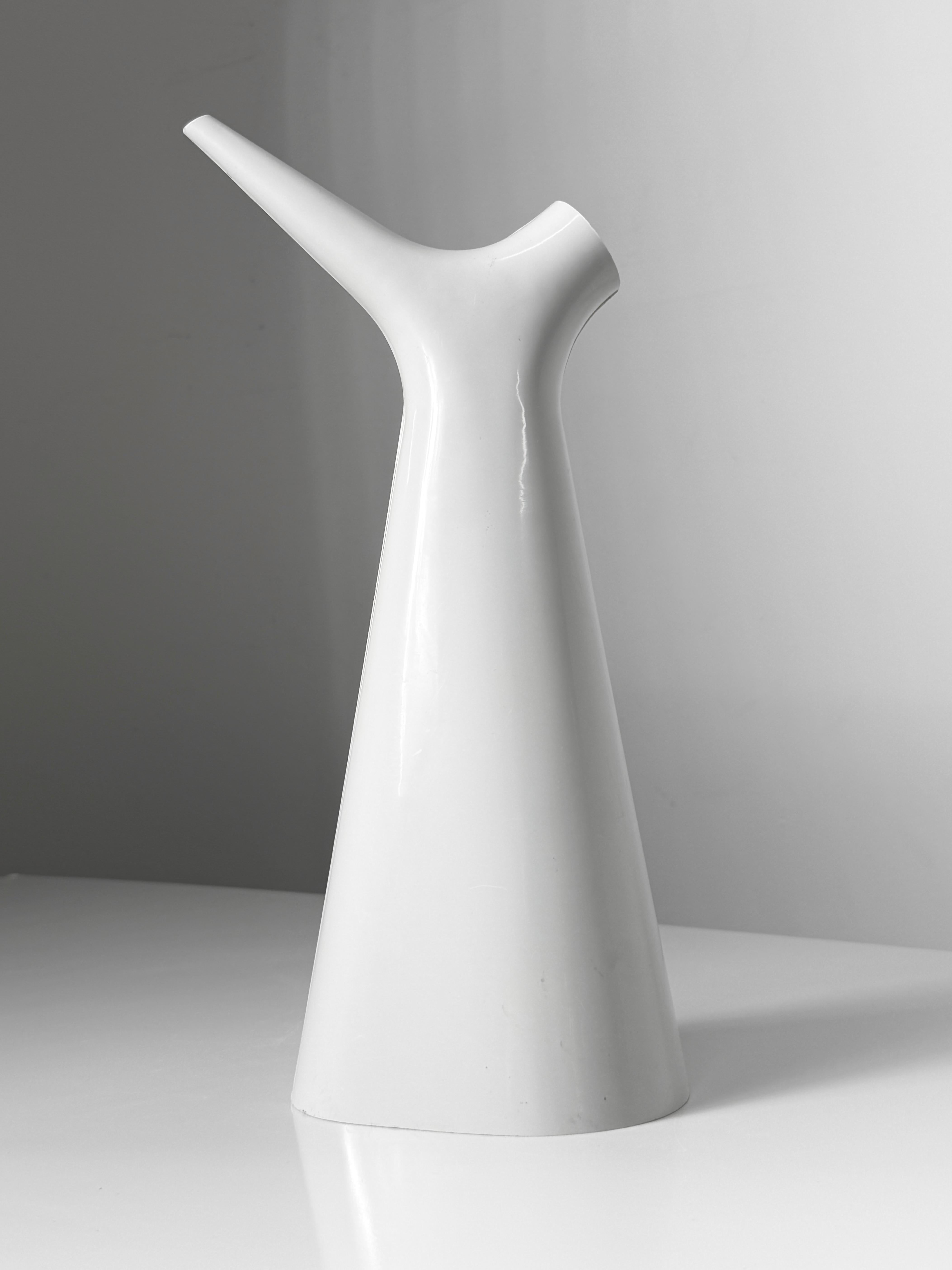 Sculptural plastic watering pitcher designed by Carl-Arne Breger for Gustavsberg Sweden circa 1950

Asymmetric form with narrow spout and larger fill hole
Original label intact to underside 

7 inch width
4 inch depth
13.375 inch height