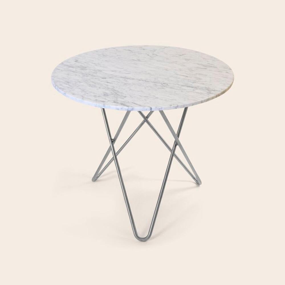 White carrara marble and steinless steel large dining o table by OxDenmarq.
Dimensions: D 100 x H 72 cm.
Materials: steel, white carrara marble.
Also available: different marble and frame options available.

OX DENMARQ is a Danish design brand