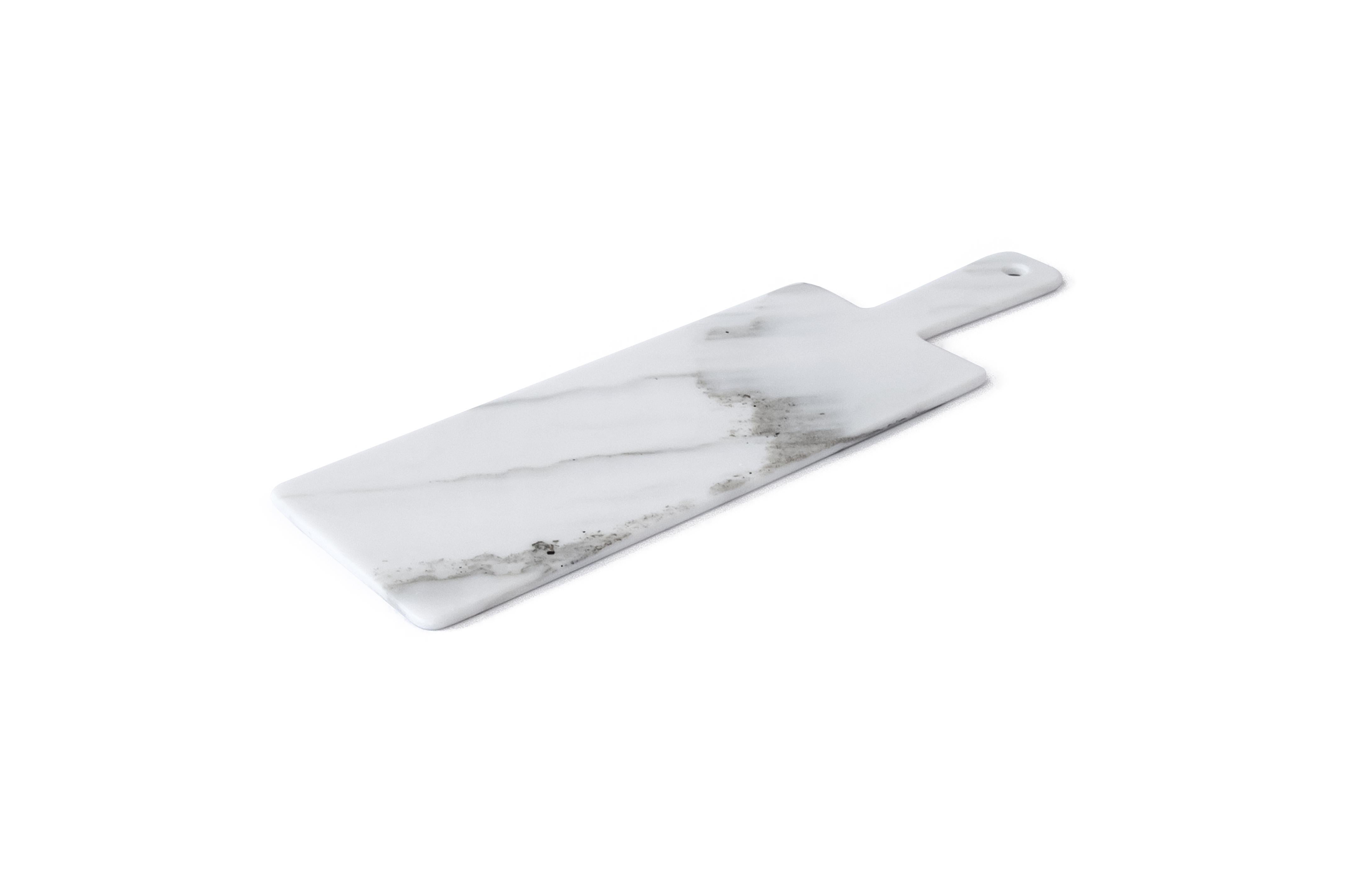 White Carrara marble big long chopping board.

Each piece is in a way unique (every marble block is different in veins and shades) and handmade by Italian artisans specialized over generations in processing marble. Slight variations in shape,