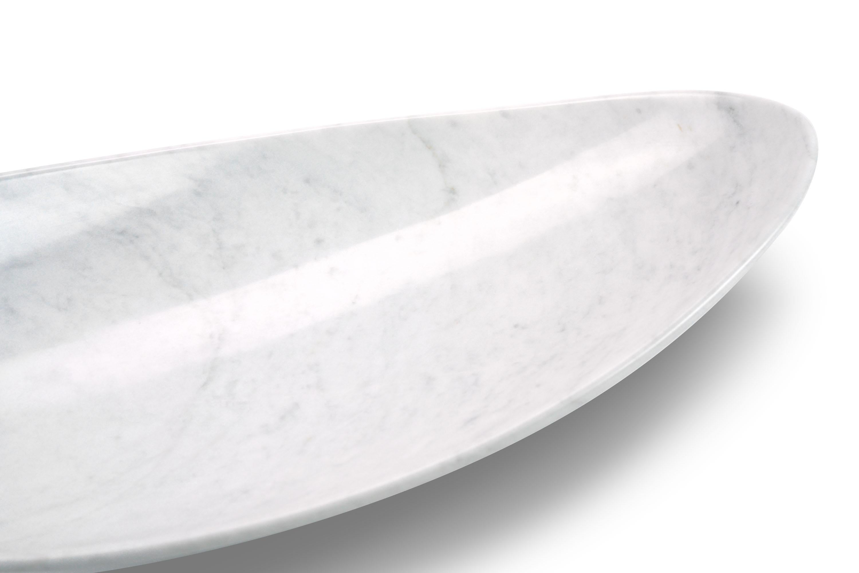 Bowl sculpted by hand from a solid block of white Carrara marble. Polish finishing. 

Dimensions: Big L 56 x  W 27 x  H 12 cm. 
Also availabe: Medium L 45 x W 22 x H 10 cm, Small L 35 x  W 17 x H 8 cm.
Available in different marbles, onyx and