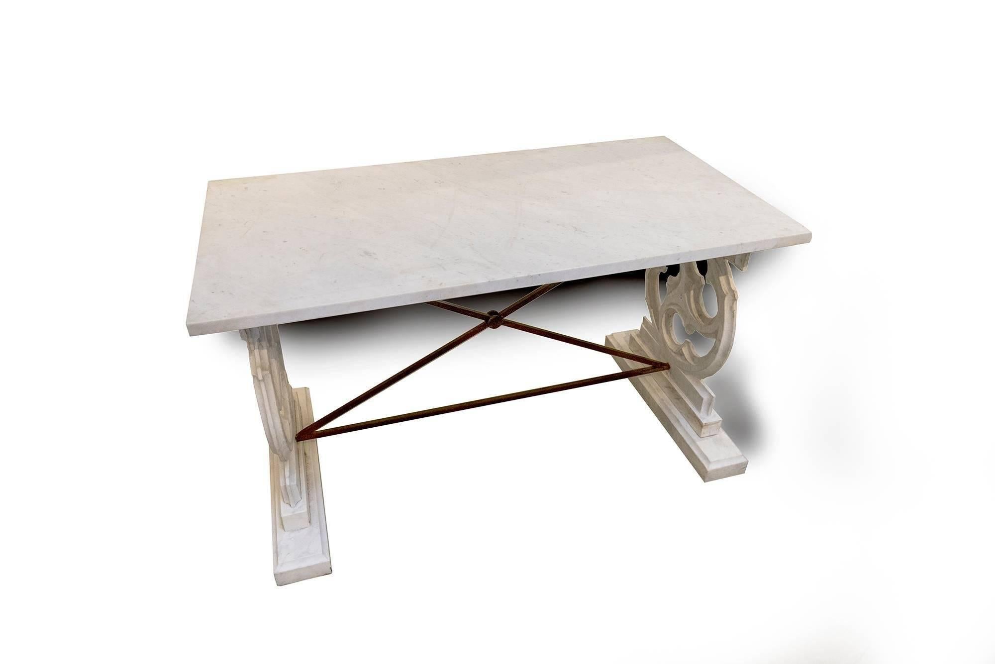 An exceptionally marvelous piece serves as a console, a work table, a garden accent or entry console. Such a magnificent design with the side pieces carved and the studs providing additional support or as a footrest if used as work table.