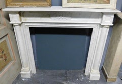 White Carrara marble fireplace carved, central flower and side columns, Italy