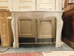 White Carrara marble mantle fireplace, richly carved with three shells, France