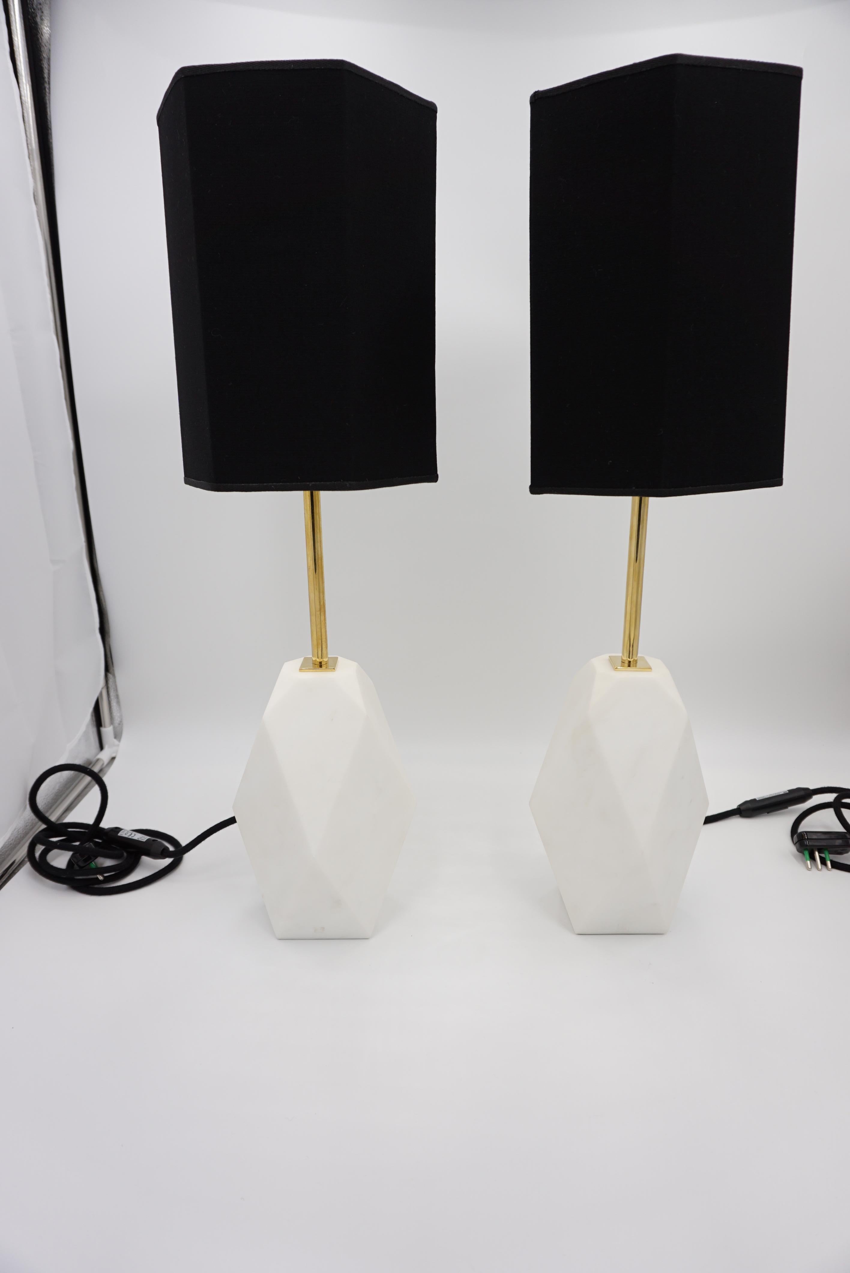Pair of table lamps PRISMA by Lorenzo Ciompi
Extremely white Carrara marble carved in a prism shape
Brass structure , black cotton lampshade ( gold inner) at parallelpiped shape
all handmade
Measures: 20 x 20cm H 62.5 cm ; the base marble: 16 x