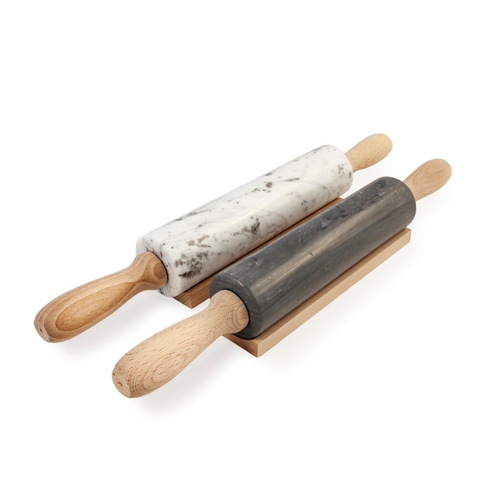 White carrara marble rolling pin. It is assembled manually. Each piece is in a way unique (every marble block is different in veins and shades) and handmade by Italian artisans specialized over generations in processing marble. Slight variations in