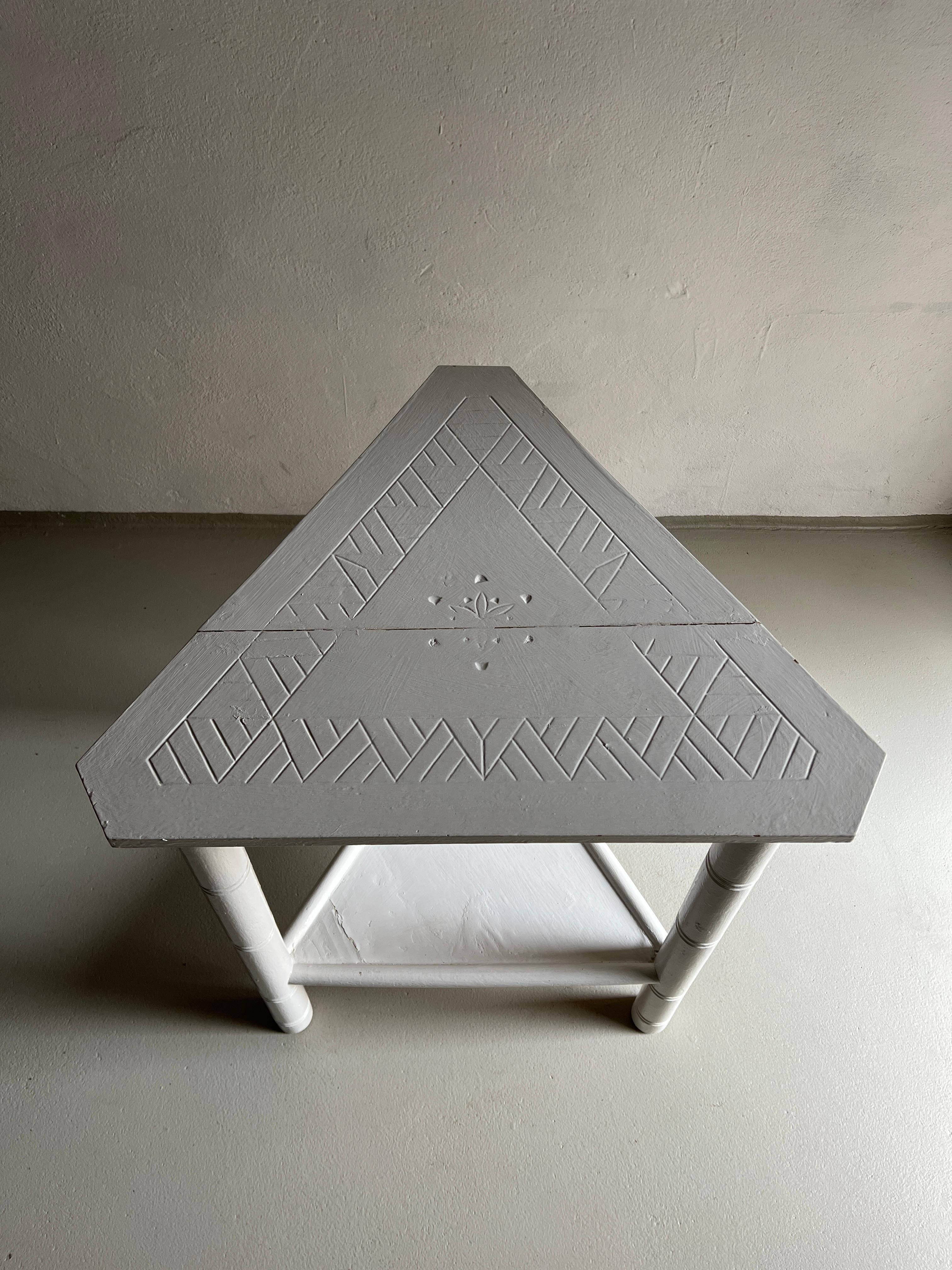White-painted carved wood side table made of solid pine. 

Dimensions - H 74.5 cm, side 58.5 cm, corner cut 8 cm.