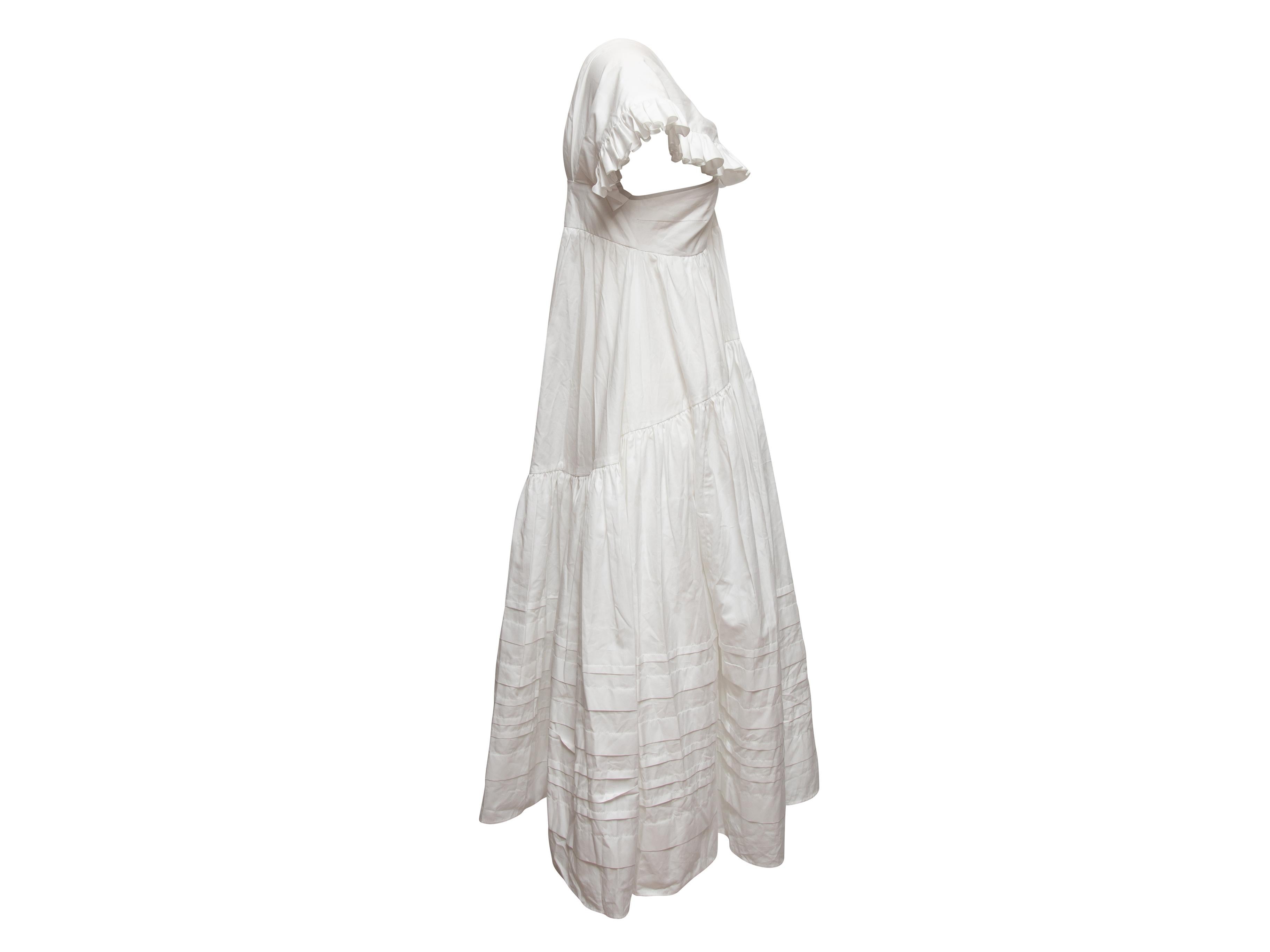 White cotton Rikke dress by Cecilie Bahnsen. From the Spring/Summer 2019 Collection. V-neck. Ruffle-trimmed short sleeves. Tiered skirt. 32