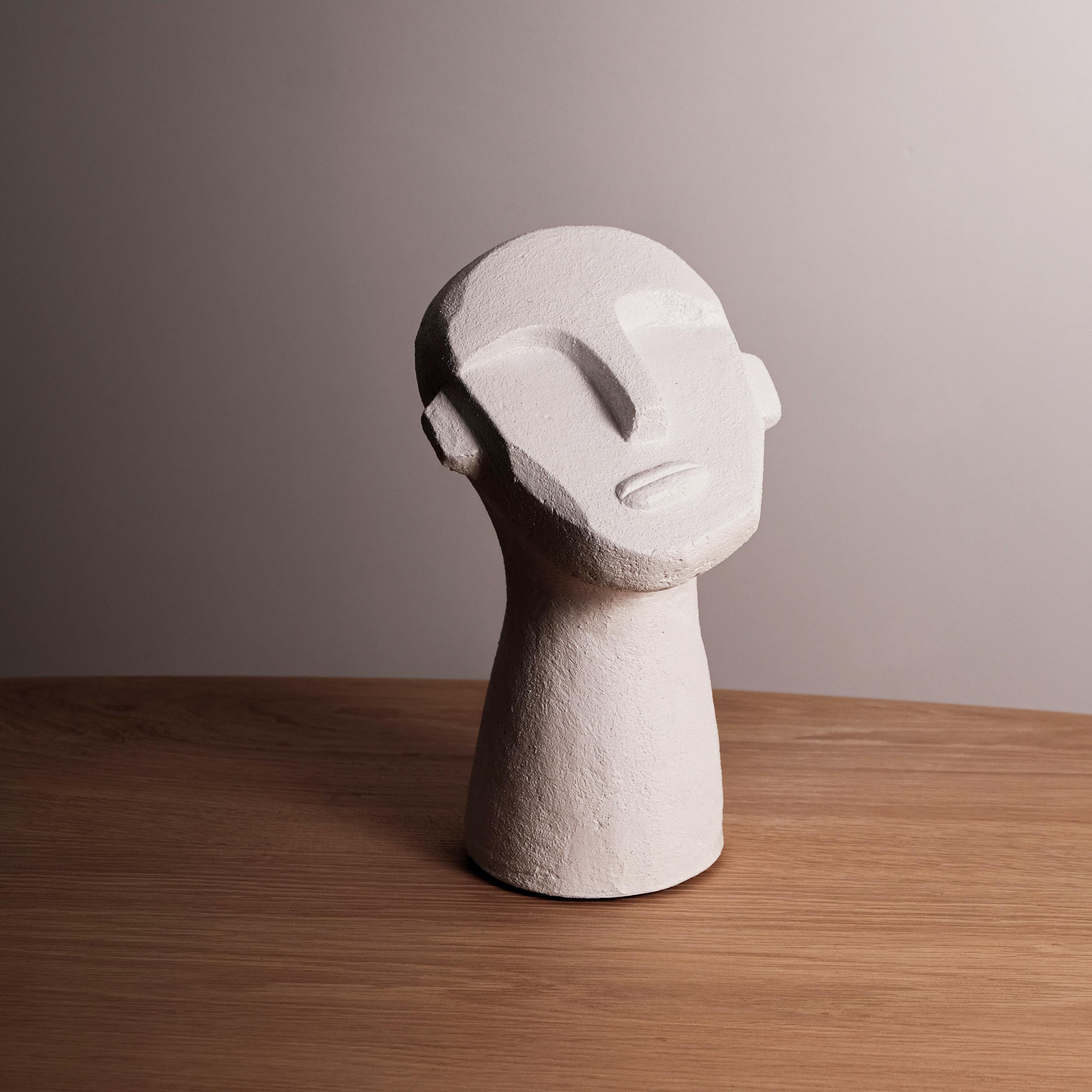 White cement cast molded Brutalist style bust tabletop sculpture.