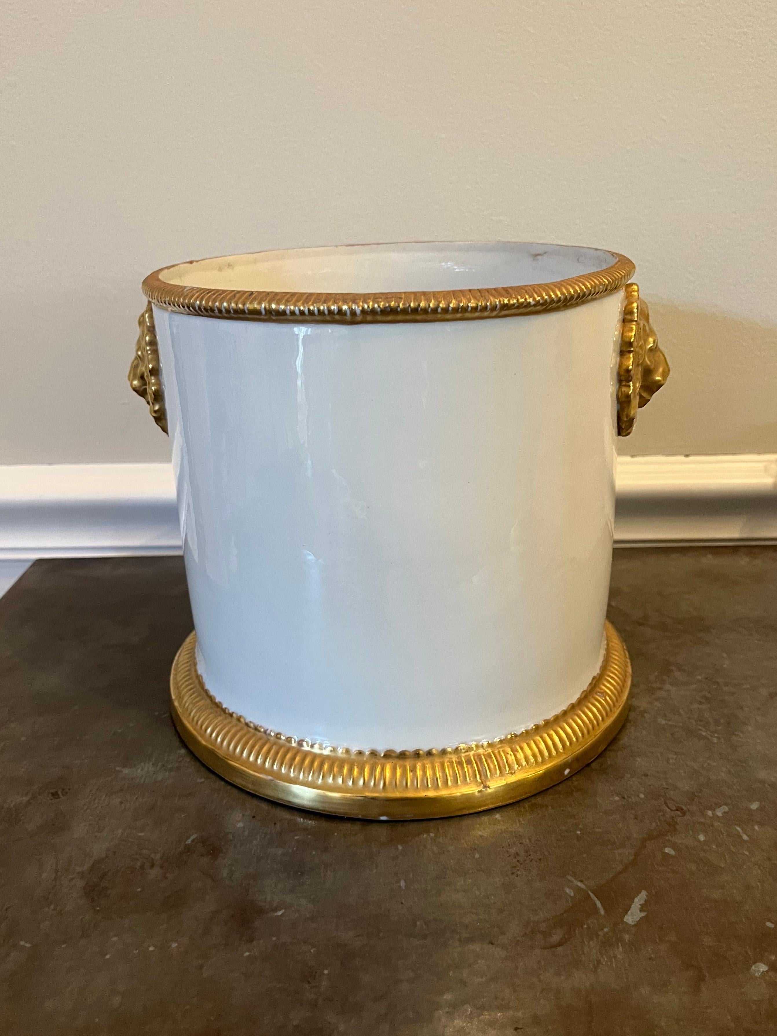A Hollywood Regency white with gilt beaded trim and lion's head handles. Having the original Mottahedeh foil label and marked Italy.