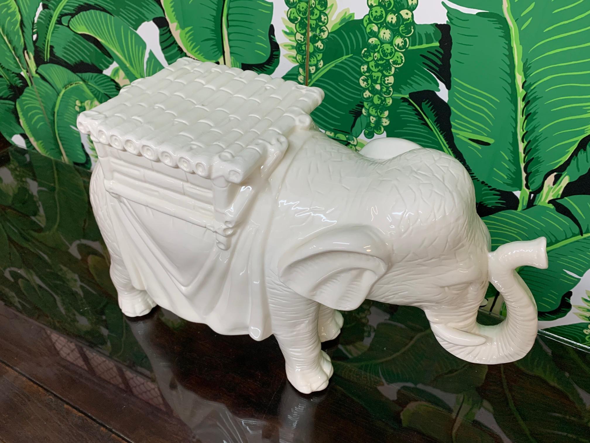 Beautiful white ceramic elephant statue can be used as a garden stool, side table, or a decorative piece for any decor. Very good condition.