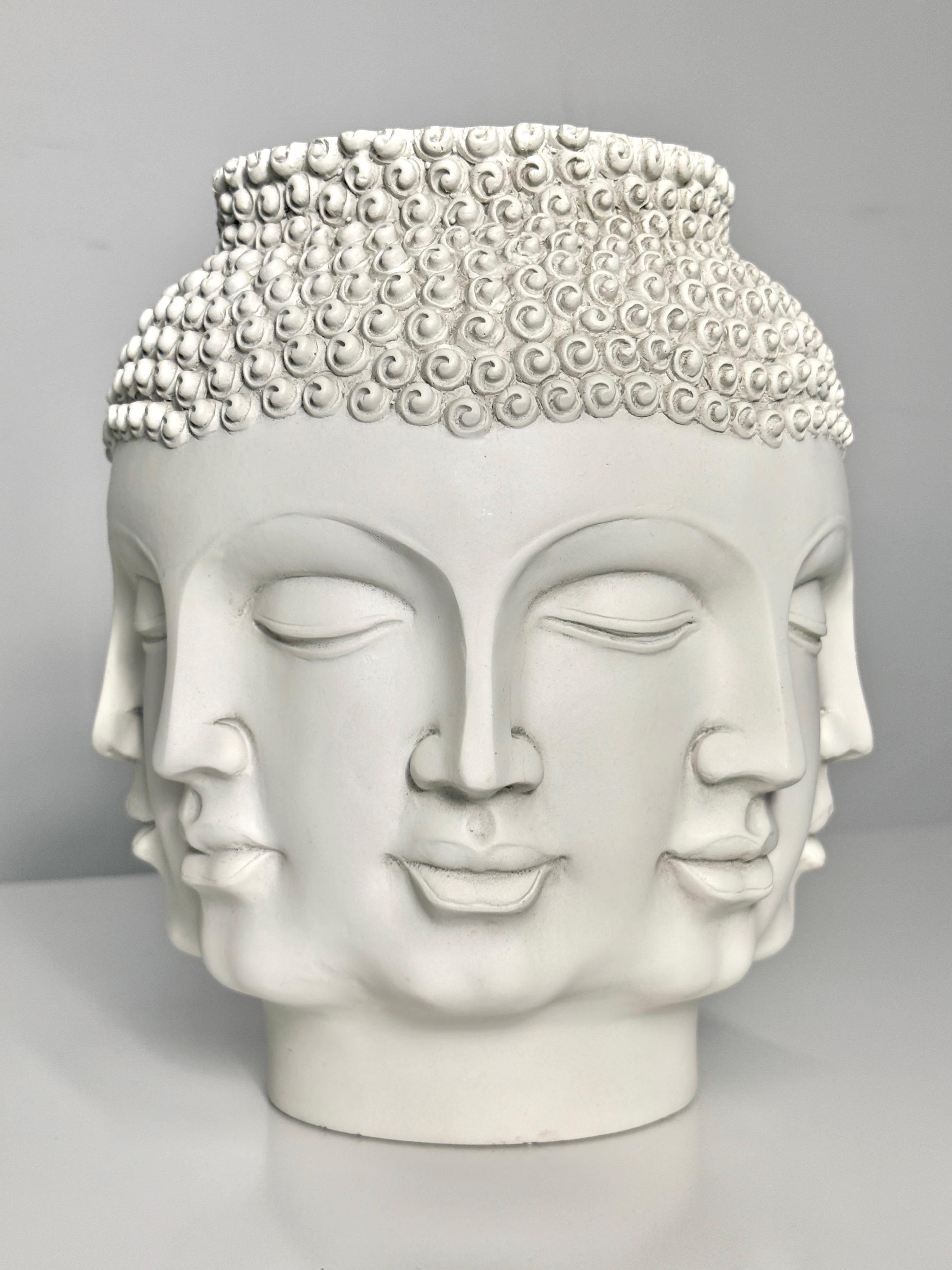 Multi face Buddha head vase by TMS Inc
Vitruvian collection, 2006

Perpeptual face design in matte white ceramic with upper crown of intricate coils
Signed and dated to lower edge

8 inch diameter
9.5 inch height

Complimenting black vase shown is