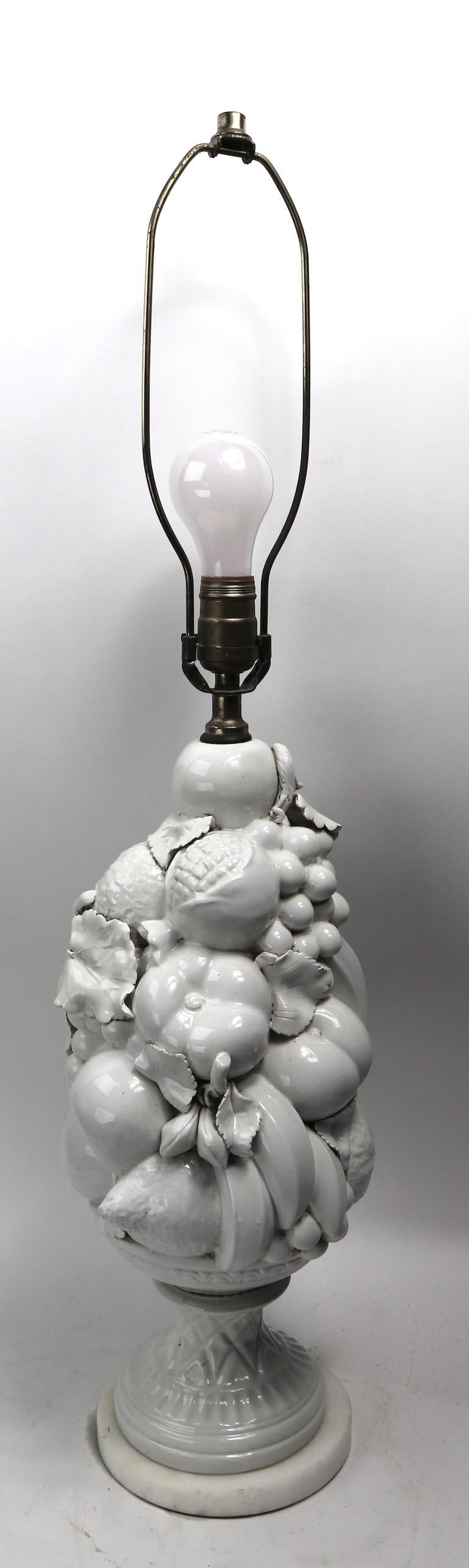 Nice decorative white glaze ceramic table lamp on marble disk base. Original, clean and working condition, accepts standard size screw in bulb, shade not included. Height to top of ceramic body 19.5 total height, 32.5 diameter. Of base 6 x diameter