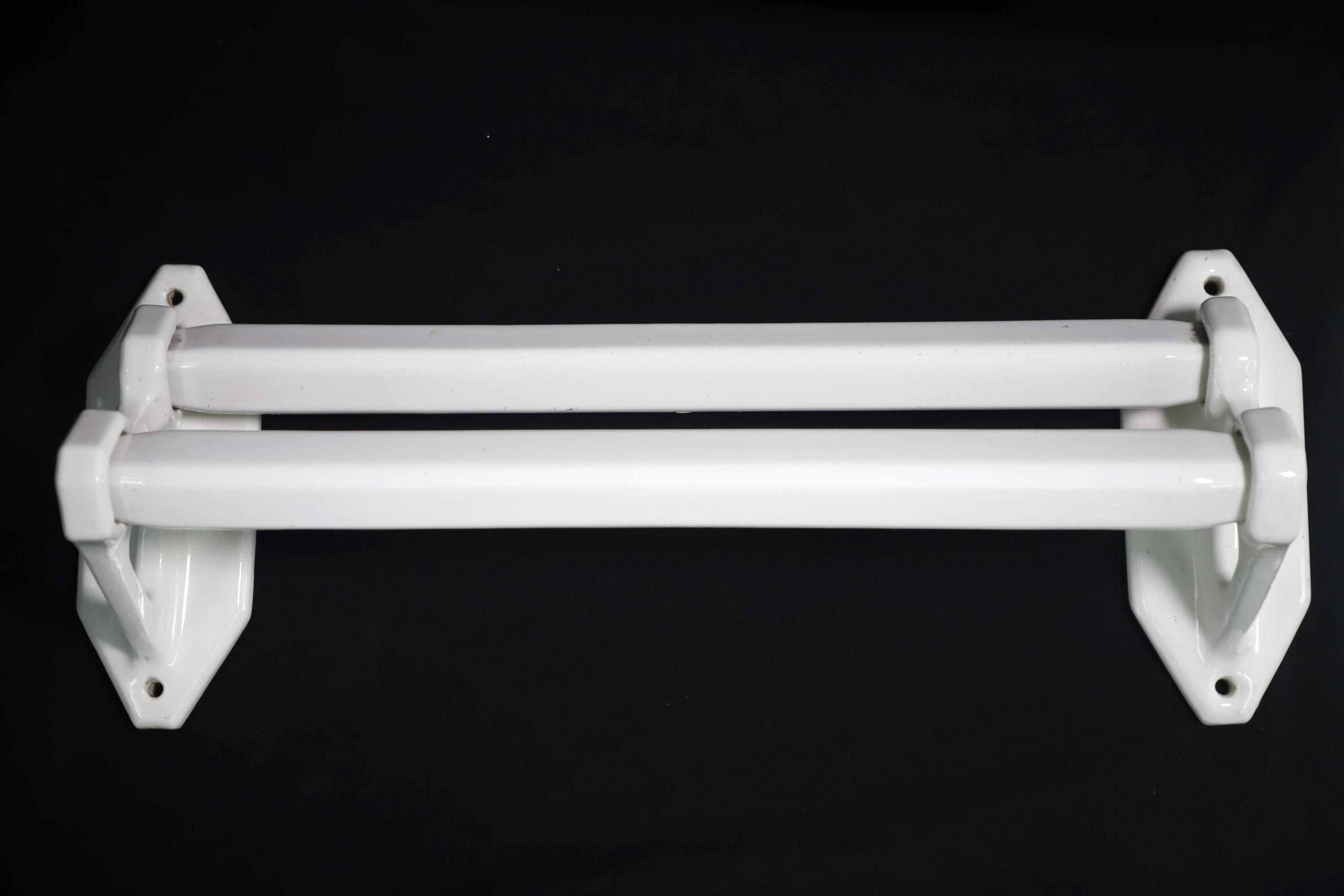 From Europe, this wall mounted white towel bar holds two towels. Made of ceramic. Useful in either a bathroom or kitchen. Minor chips, please see images. Please note, this item is located in our Scranton, PA location.