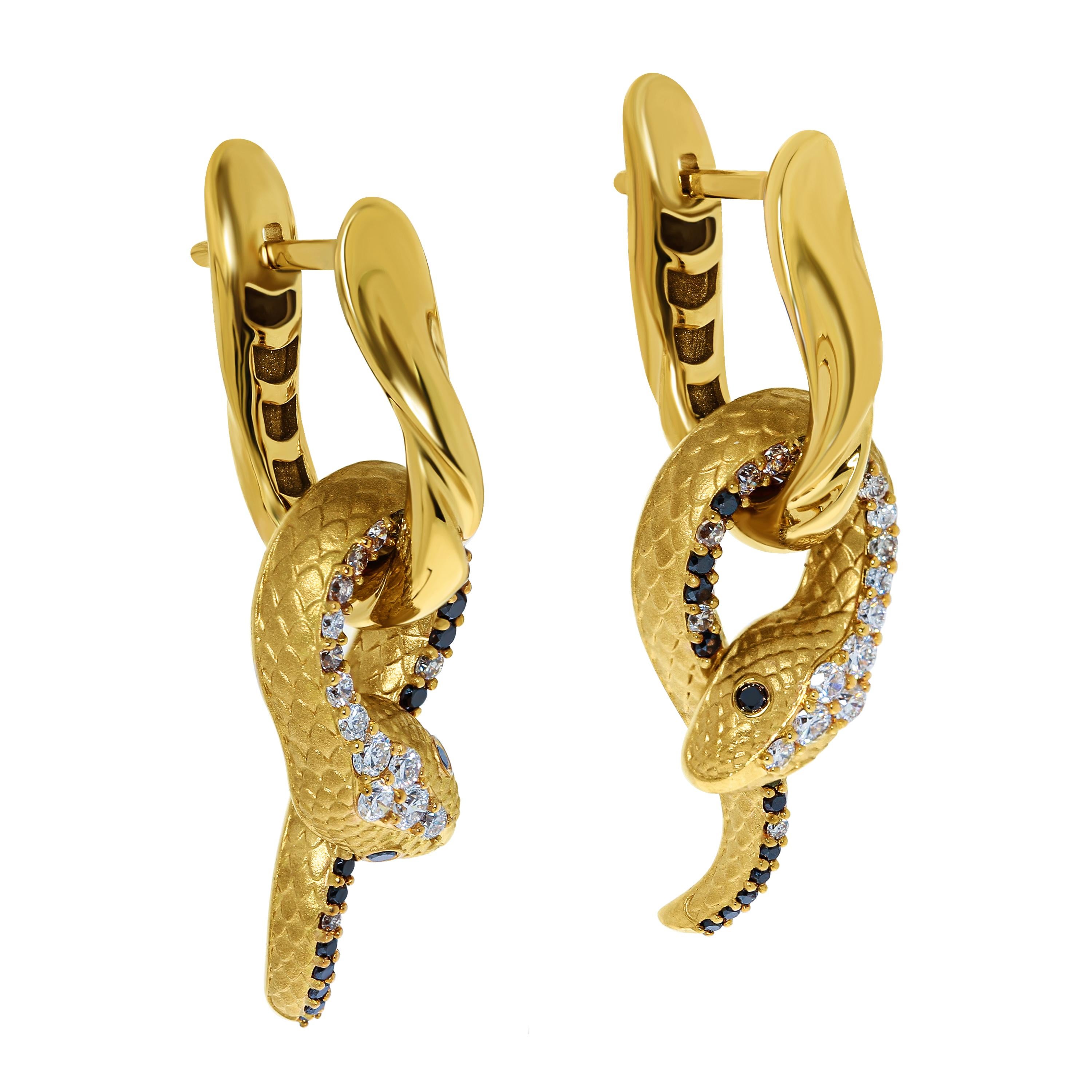 White, Champagne and Black Diamonds 18 Karat Yellow Gold Snake Earrings
The Snake is the first to be met by the Little Prince from St. Exupery's 
