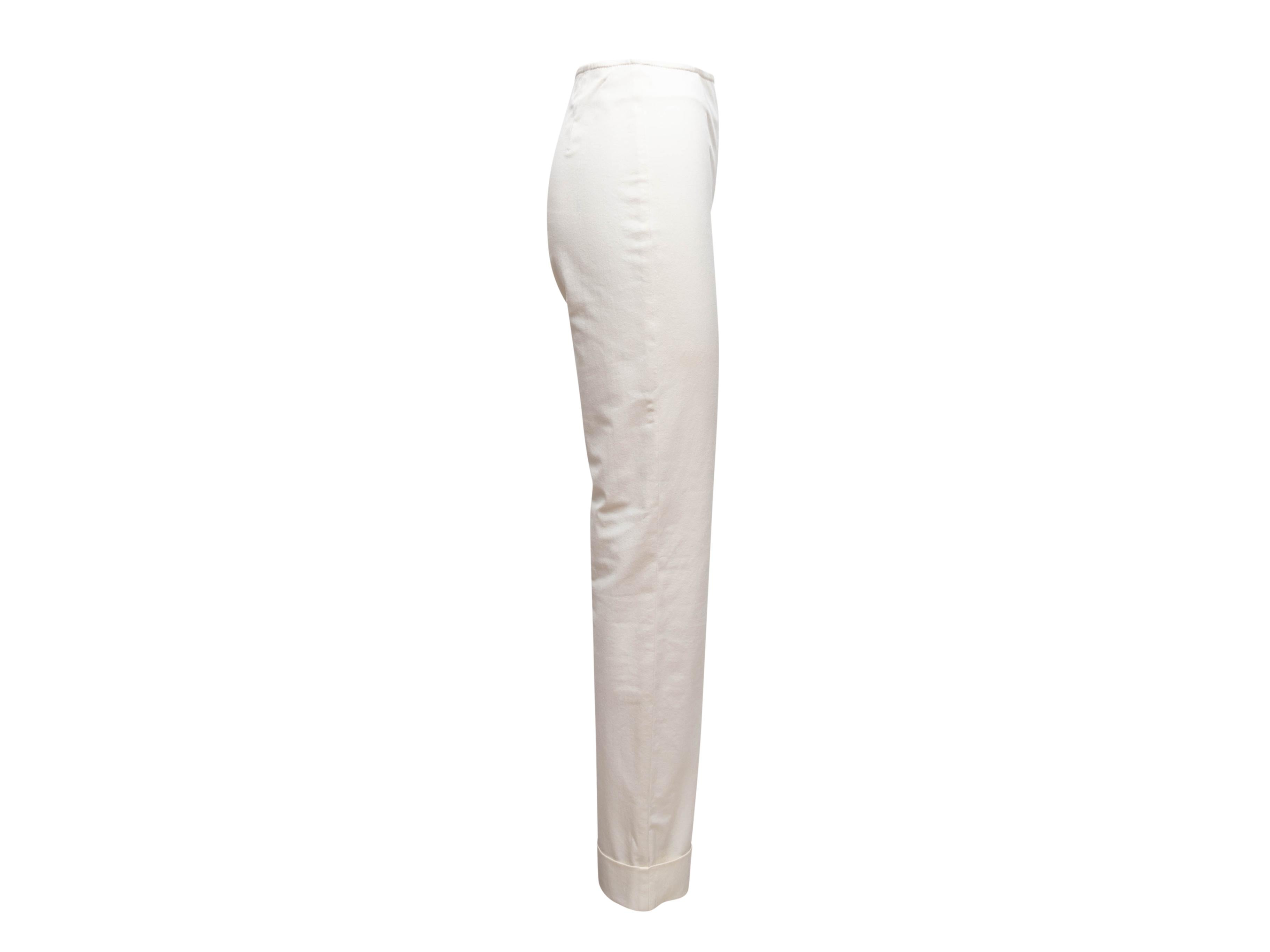 White cuffed straight-leg pants by Chanel. Side closure. 28