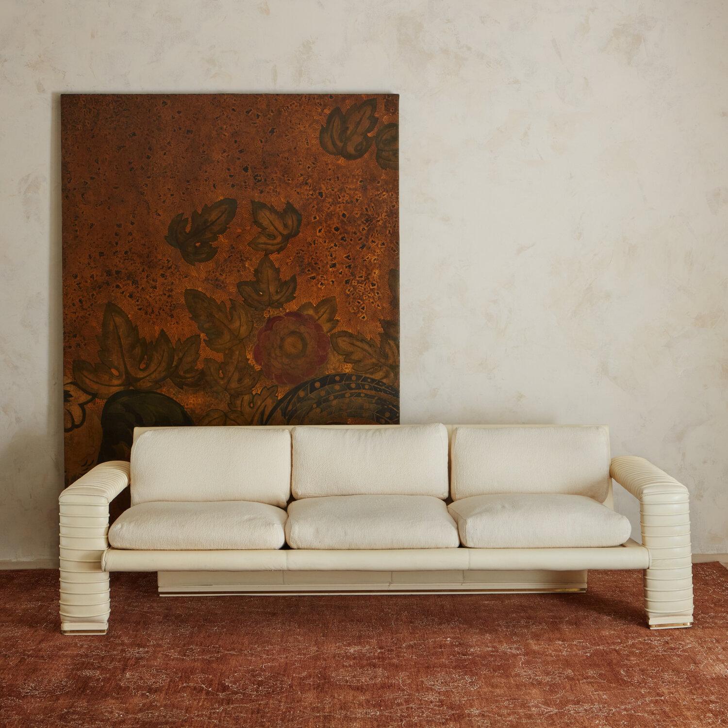 Designed by Marzio Cecchi in the late 1970’s for the Hotel Moderna in Toscano, Italy and produced by Studio Most. This sofa has an architectural appeal - with a vinyl wrapped frame that wraps around the back of the sofa in a sculptural fashion. The