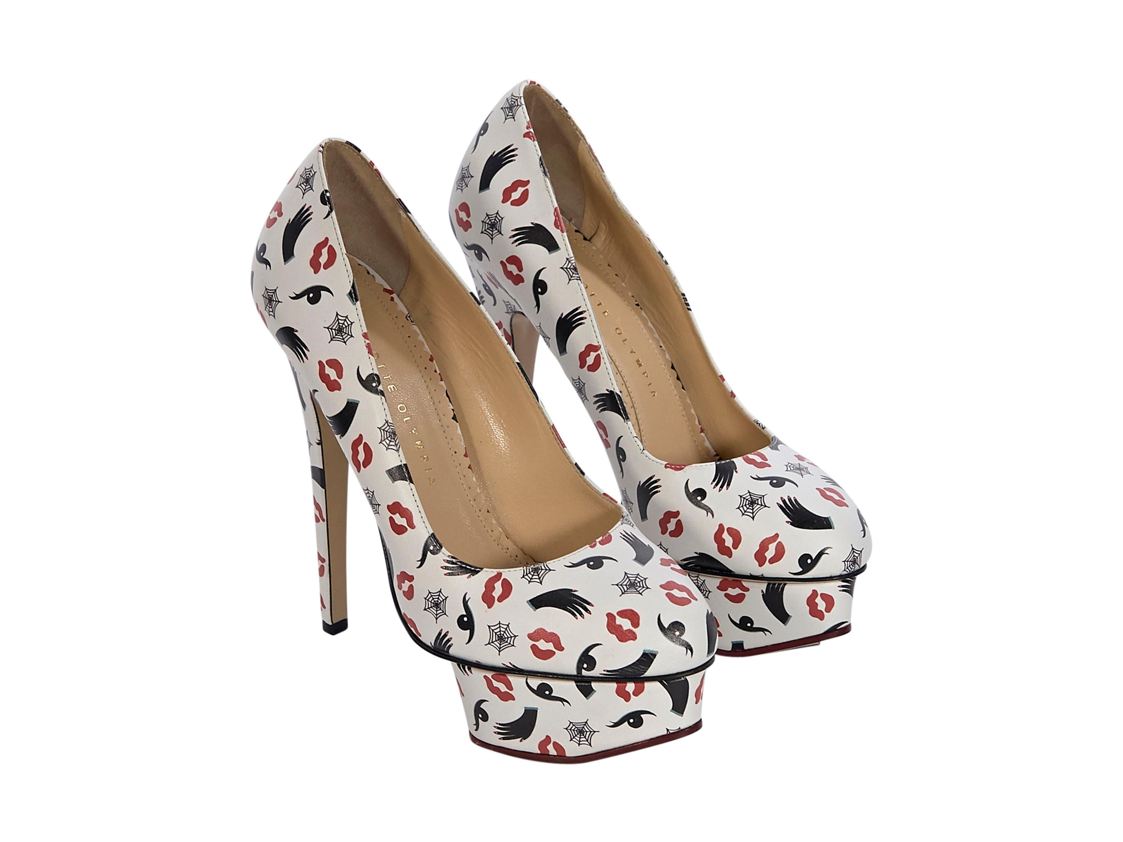 Product details:  White leather printed platform pumps by Charlotte Olympia.  Round-toe. Slip-on style. Wear yours with high-waist straight-leg pants. 5.5