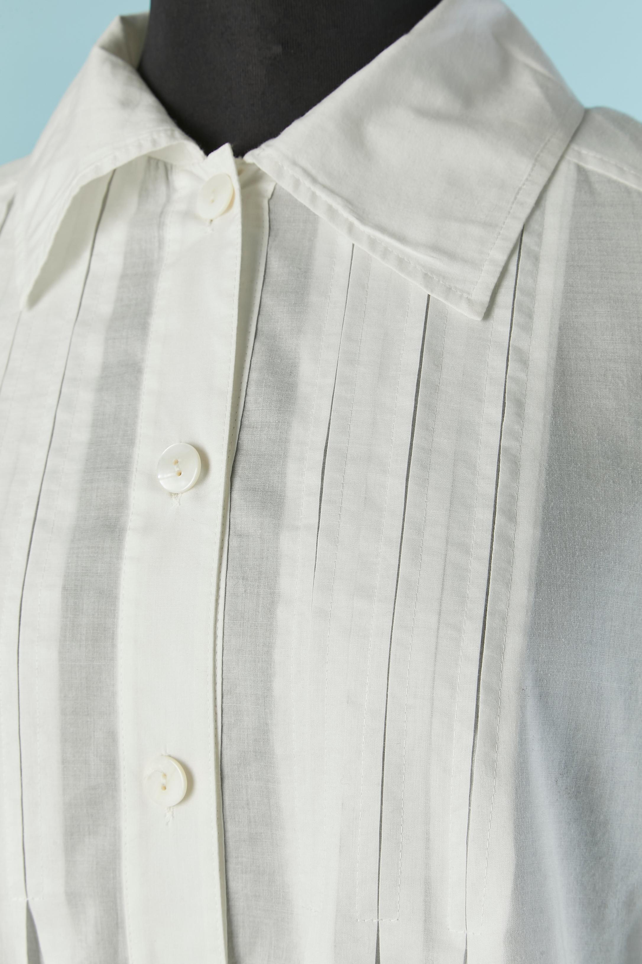 White chemise dress. fabric composition: 55% cotton, 45% polyester. 
Button and buttonhole closure on the middle front and on the cuff. Pleated on the front.
New with tag
SIZE 4 (Us) 
