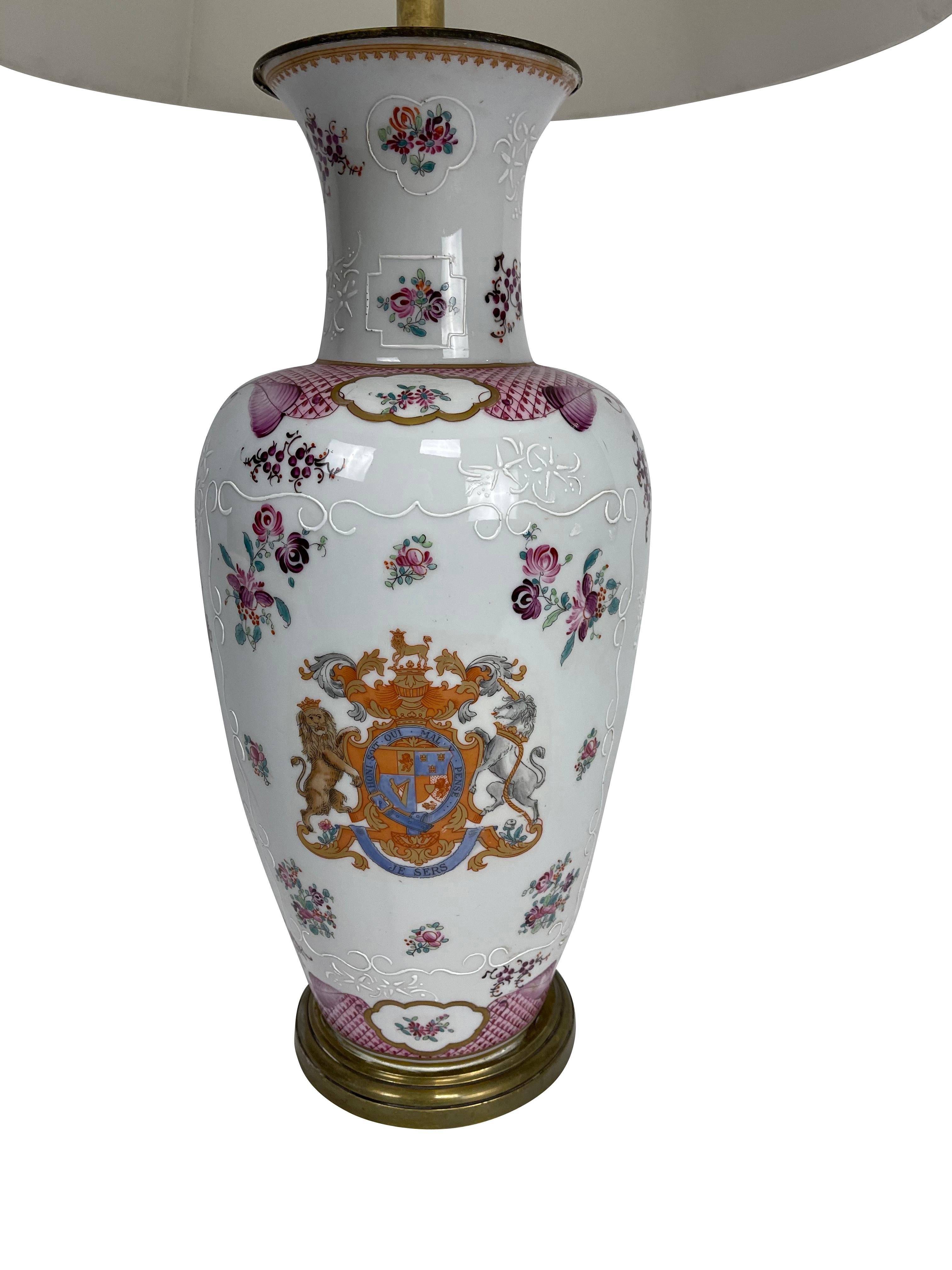 A white Chinese export baluster form Samson Armorial lamp decorated with the Order of the Garter symbol in pink blue, and orange. Order of The Garter is an order of chivalry founded by Edward III of England in 1348. It is the most senior order of