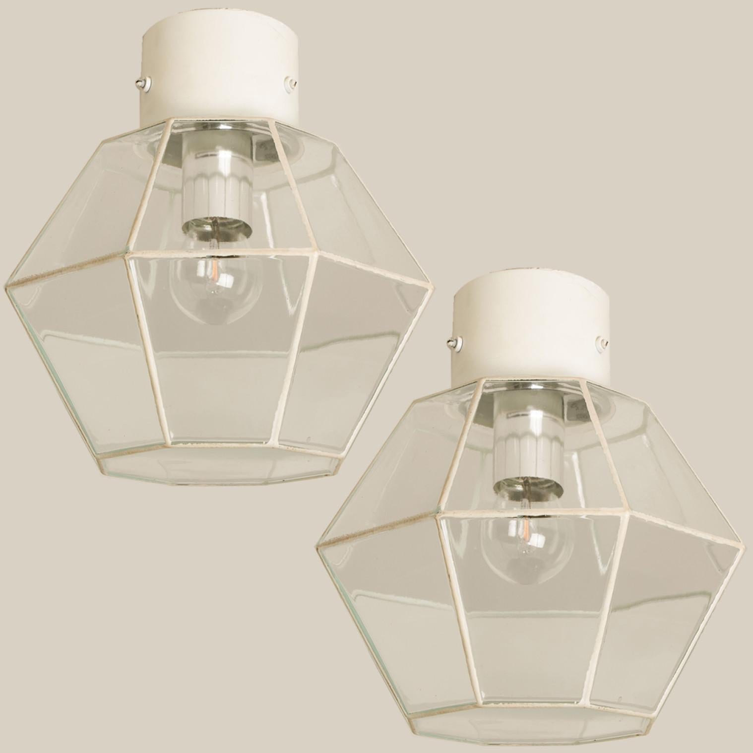 A beautiful set of octagonal glass light flush mounts or wall lights, manufactured by Glasshütte Limburg in Germany during the 1970s. Beautiful craftsmanship. Illuminates beautifully.

Please note the price is for one piece. Two pieces