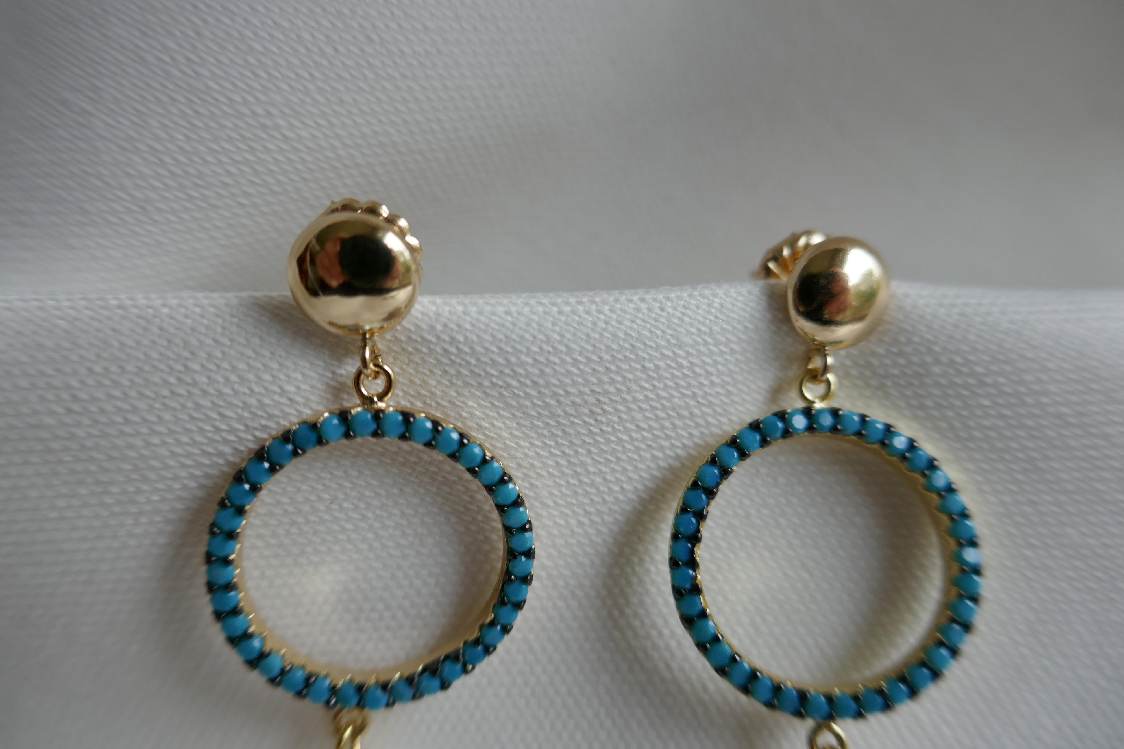 Great earrings specially for summer. The earrings have large white cultured coin pearls 19mm that hang from a turquoise 925 sterling silver vermeil bead. Attached to 14k gold filled 7mm post.  These earrings can be dressed up or down.  The earrings