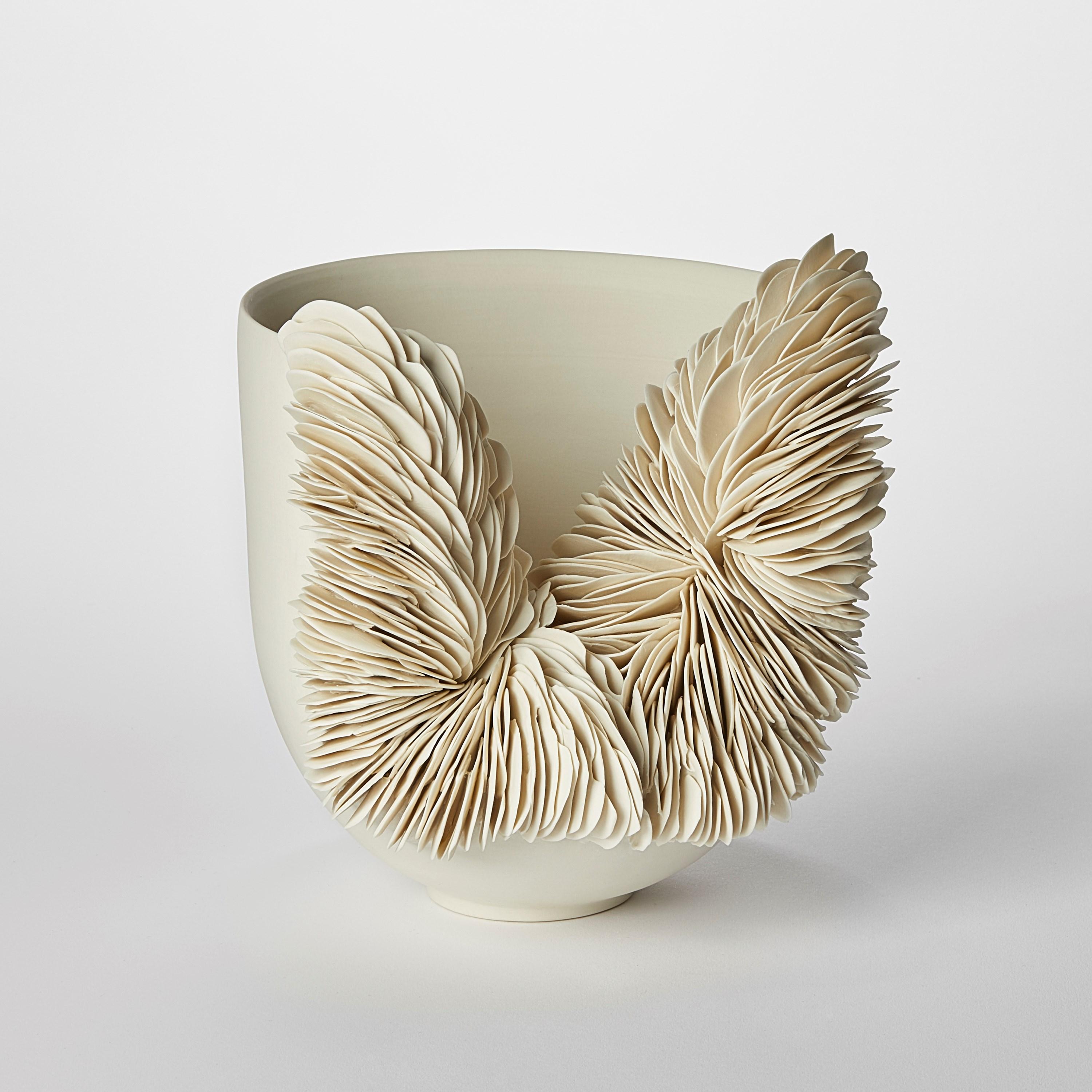 'White Collapsed Bowl' is a unique porcelain sculpture by the British artist, Olivia Walker.

Walker works in porcelain to create pieces that explore ideas of growth and decay through the construction and layering of complex surfaces.

All of her