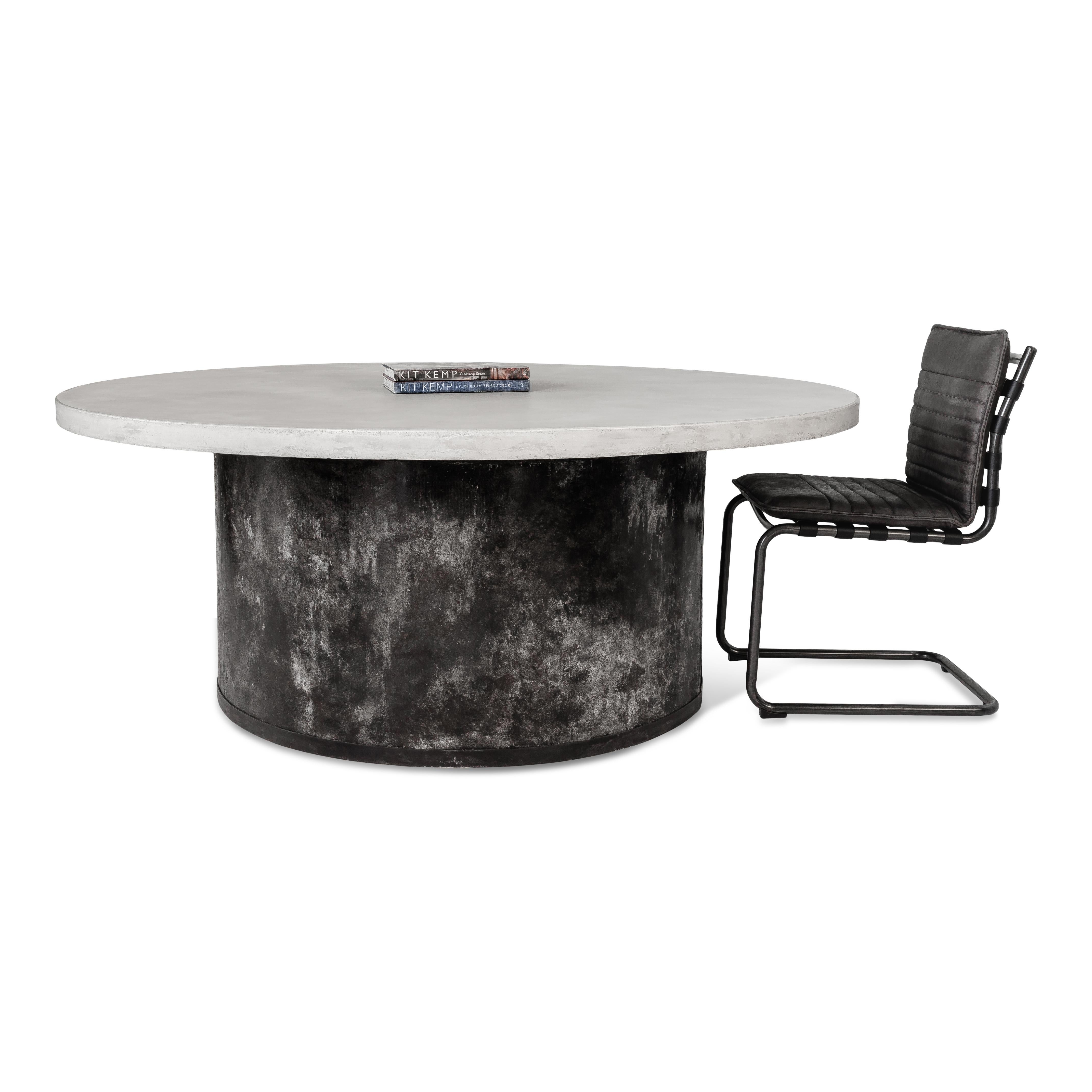 White concrete round top dining table with industrial barrel base.

Piece from our one of a kind collection, Le Monde.