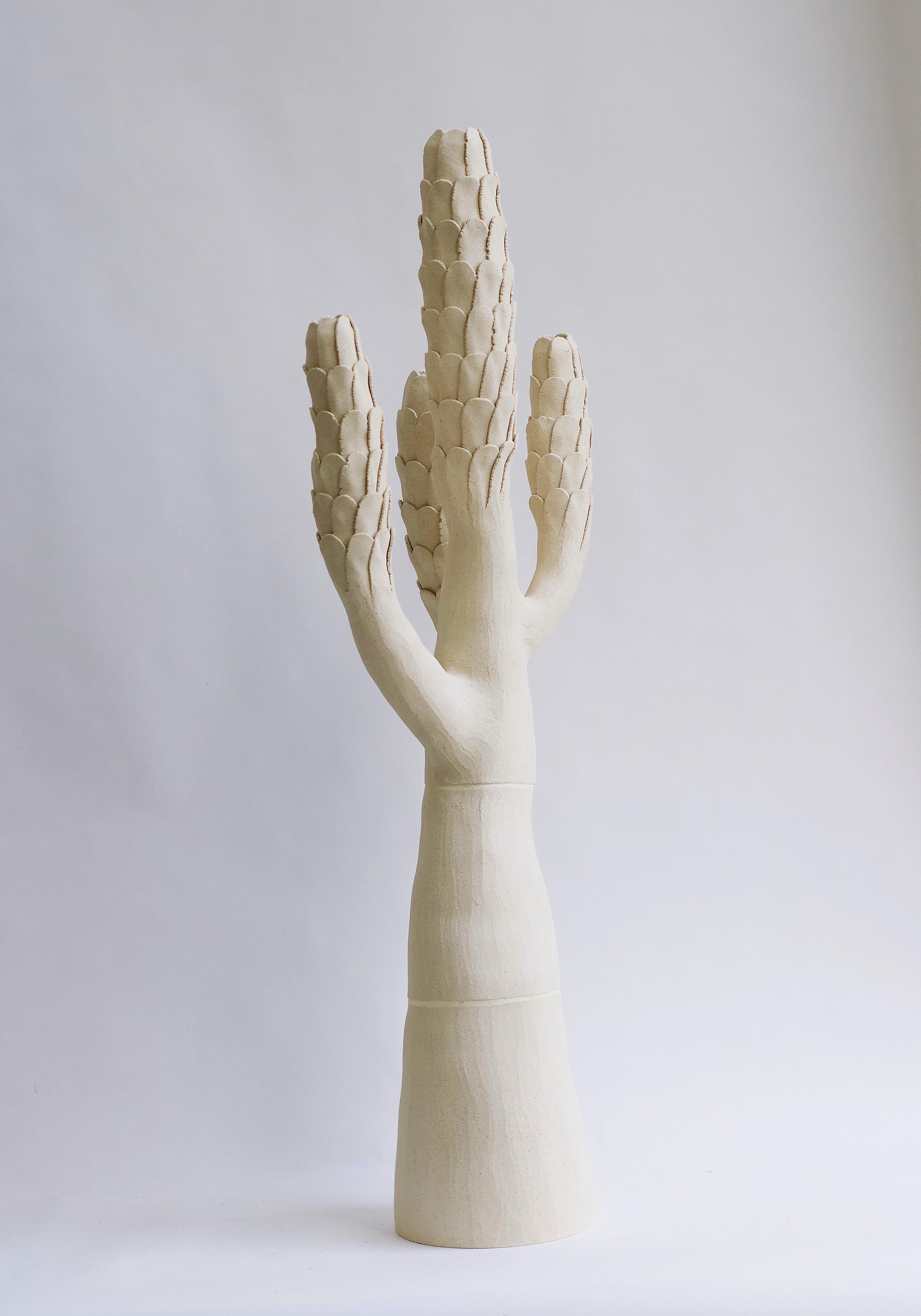 Large contemporary tree sculpture with scaled branches, hand-built of white ceramic. The organic forms and rich textures express the intense beauty of nature. An eye-catching piece for an entryway or a living room!

Each piece is one of a