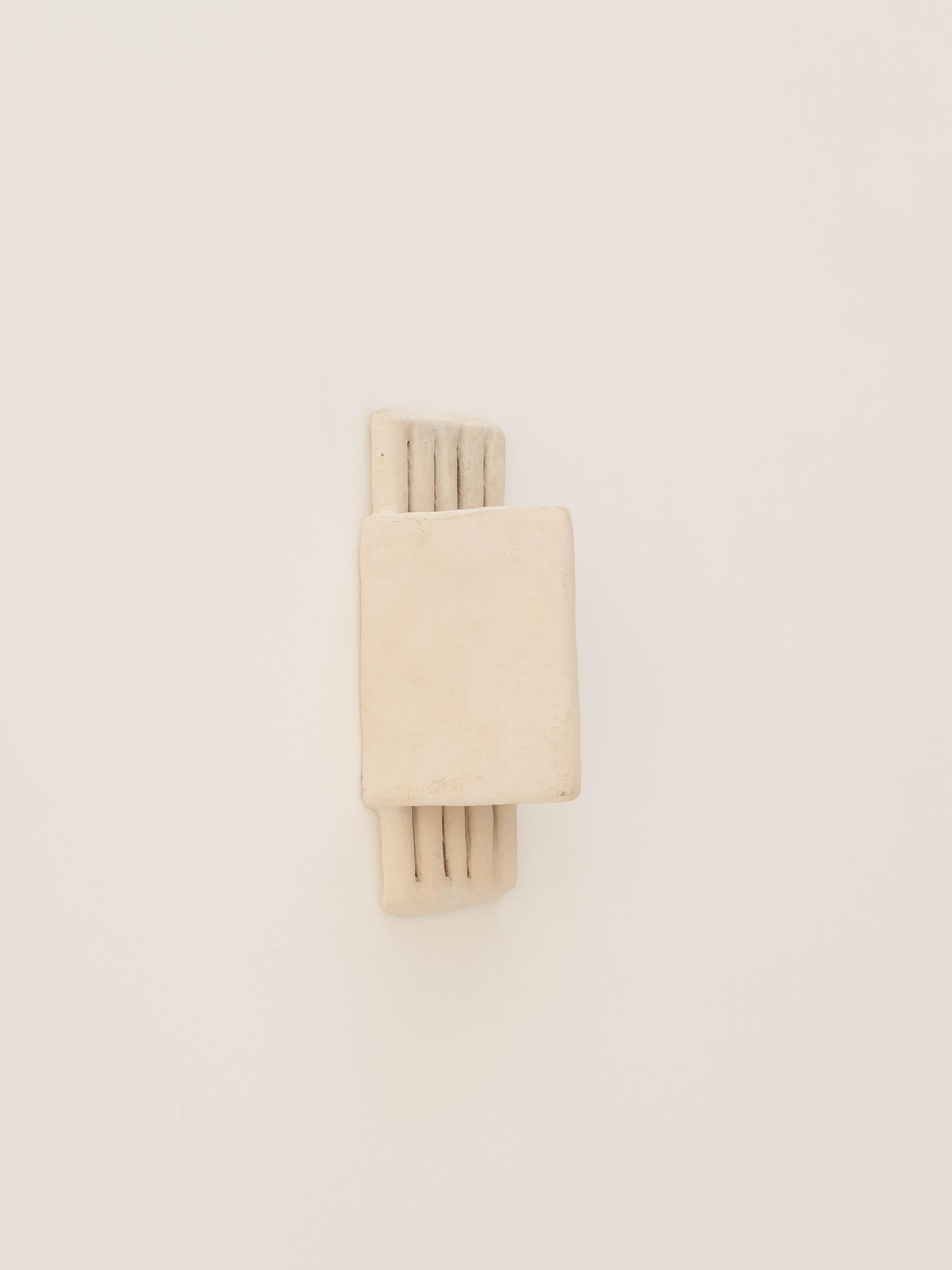 - Handbuilt white ceramic wall light
- slip applied with natural pigments as whitewash with water
- made of clay collected from the potter's surroundings.
- made in the Moroccan Rif mountains by the potter Houda.
- co-created by the potter Houda x