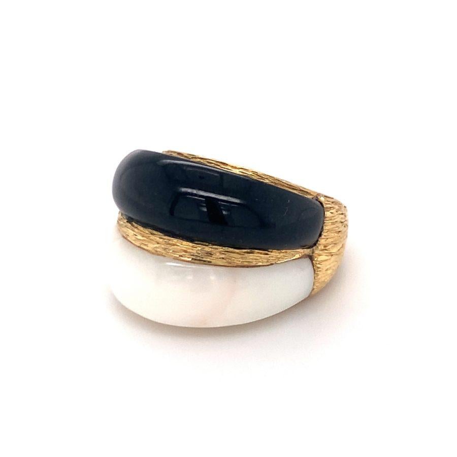 One white coral and black onyx bombe 18K yellow gold ring featuring stacked carved white coral and black onyx portions with a heavily textured gold finish design. Fashionable, elegant, terrific.

Additional information:
Metal: 18K yellow