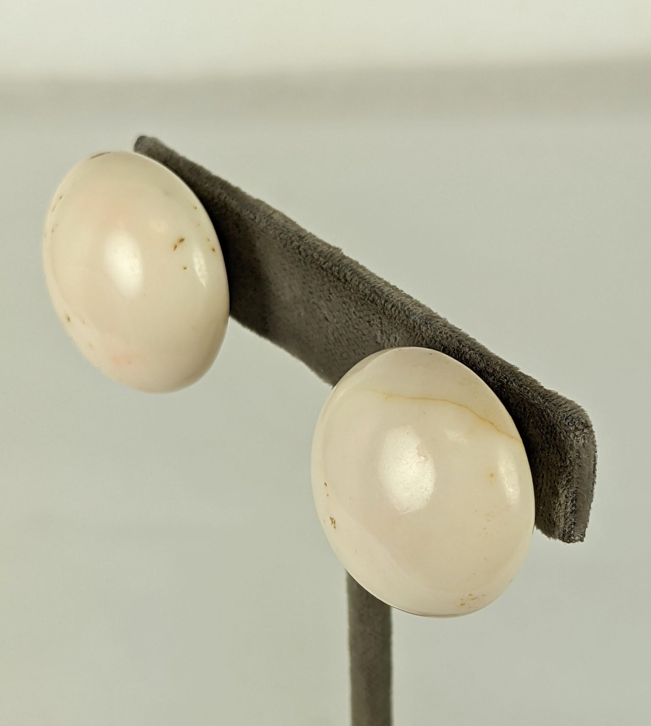 Timeless White Coral Cabochon Button Earrings set in 14k gold from the 1960's. Large button shapes are set onto gold clip back fittings. Natural coral will have imperfections as it is an organic material. Some small color spots and lines in coral.